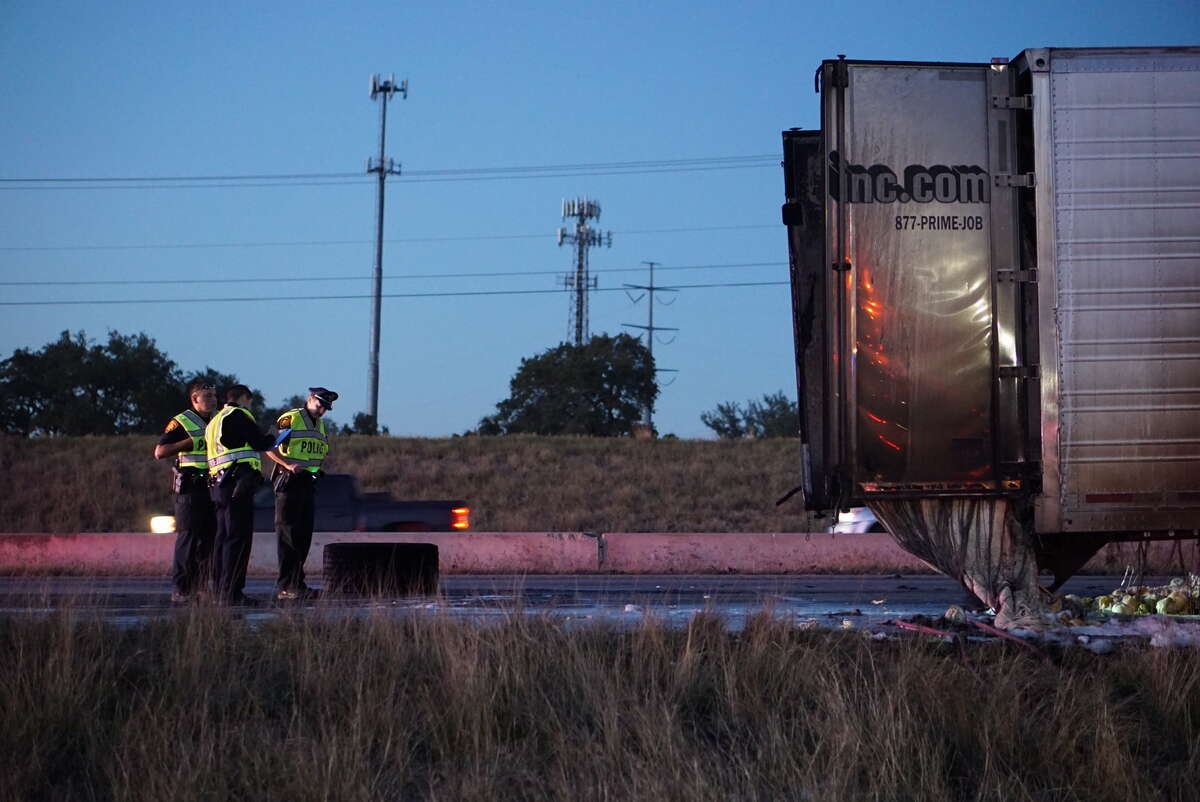 Lettuce was strewn across Loop 1604 as firefighters battled with an 18-wheeler produce truck that caught fire about 5 p.m. Saturday, Jan. 30, 2016, as it traveled east along the highway near Redland Road.
