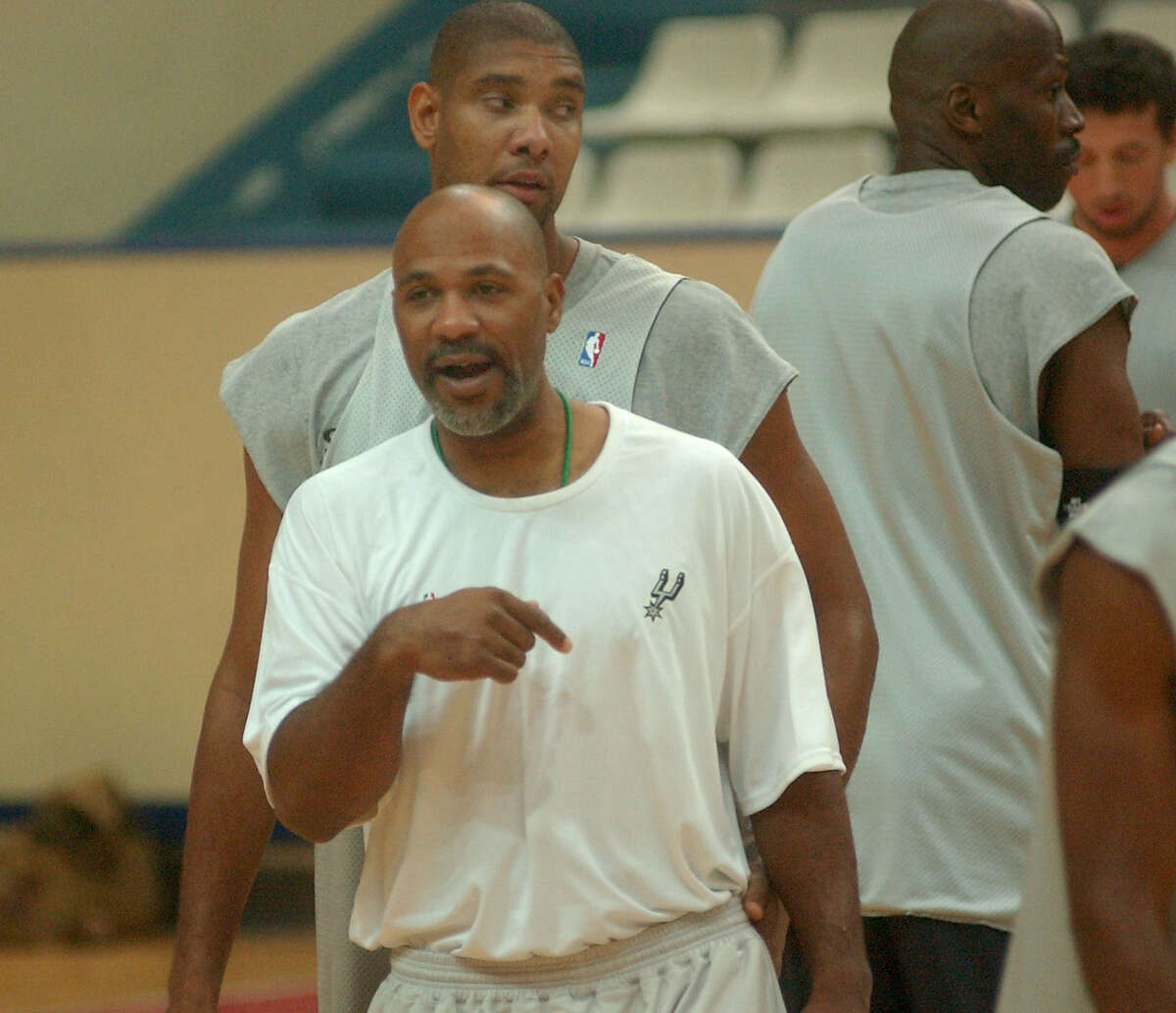 New Spurs assistant coach Mario Elie offers some advice during the San Antonio Spurs practice in Paris on Oct. 7, 2003.