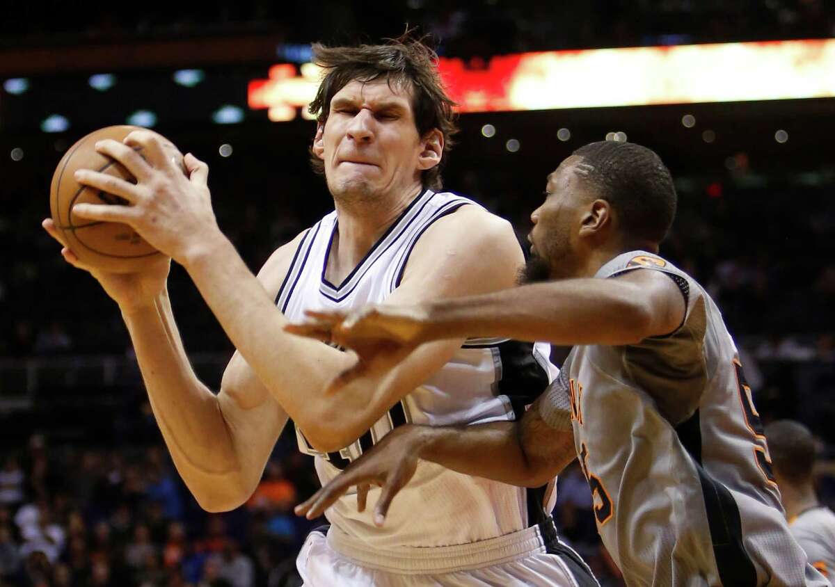 Spurs center Boban Marjanovic tries to score inside in the third quarter against the Suns on Jan. 21, 2016, in Phoenix.