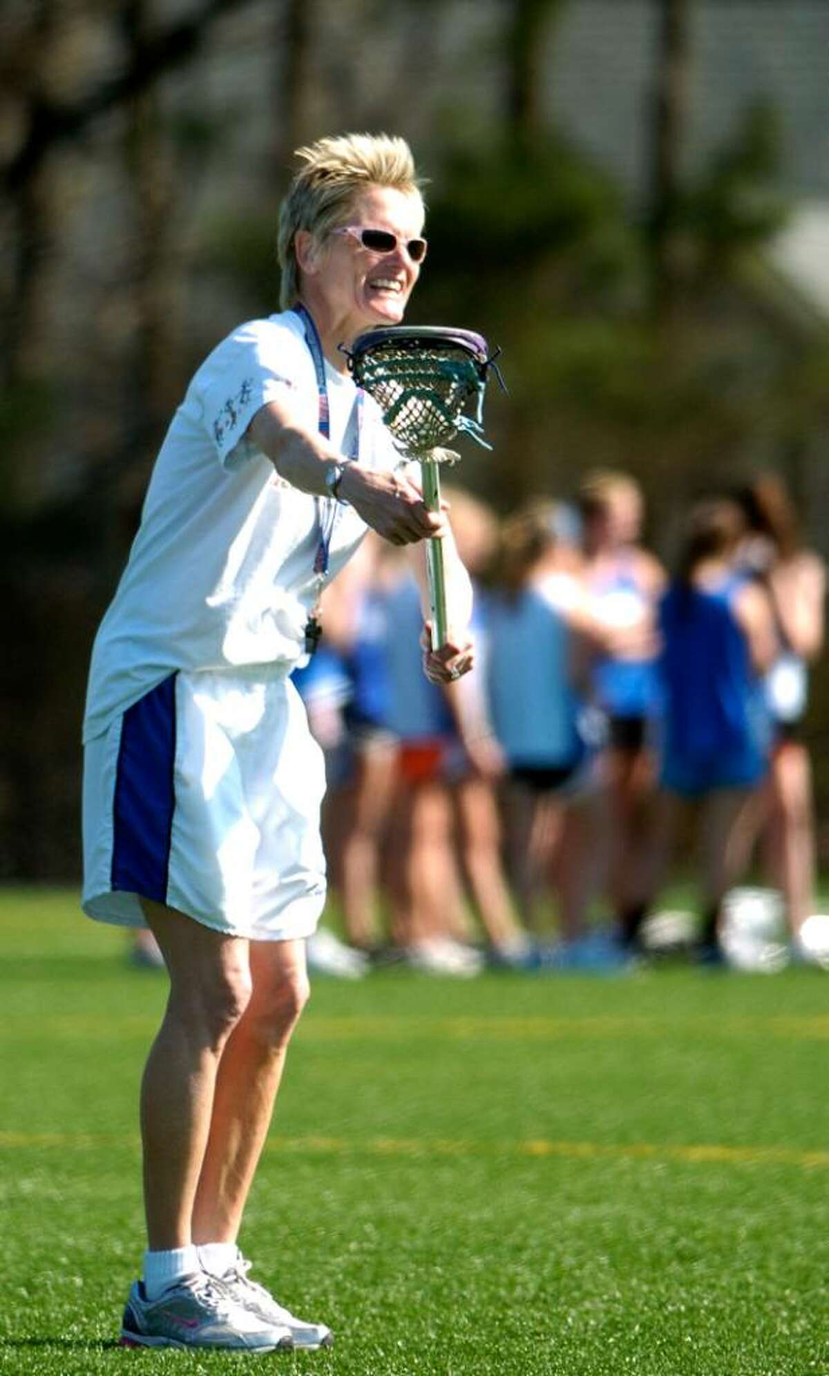 Coach Lisa Lindley works with team during girls lacrosse practice at Darien High School in Darien, Conn. on Monday April 5, 2010.