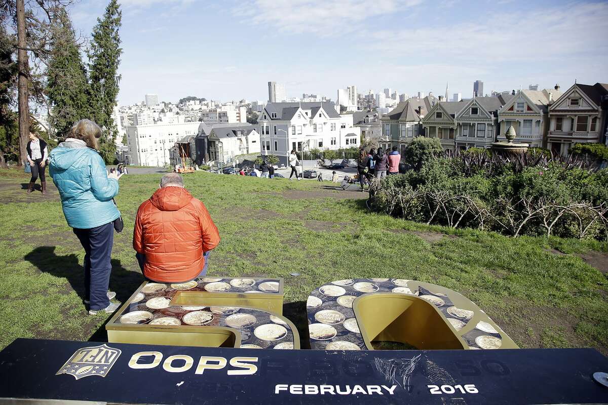A vandalized Super Bowl sign lies on the ground at Alamo Square Saturday, Jan. 30, 2016, in San Francisco. San Francisco is hosting various festivities in conjunction with the Super Bowl which will be played on Sunday, Sept. 7th, in Santa Clara, Calif.