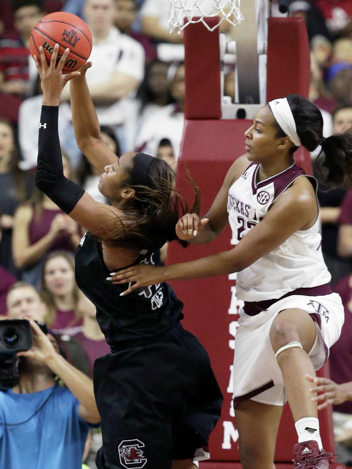 South Carolina's Alaina Coates, left, grabs a rebound ahead of Texas A&M's Rachel Mitchell (23) during the second half of an NCAA college basketball game, Sunday, Jan. 31, 2016, in College Station, Texas. South Carolina won 70-63. (AP Photo/Pat Sullivan)