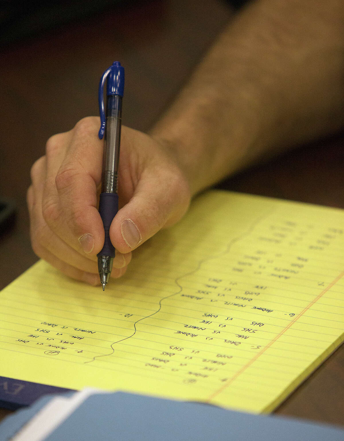Spring ISD Athletic Director, Willie Amendola, writes a schedule during the UIL Realignment and Reclassification at the Region 4 Education Service Center, Monday, Feb. 1, 2016, in Houston.