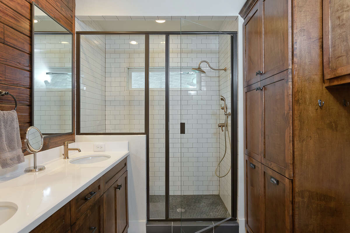 This 1926 bungalow in North Norhill got a renovation that added a new master bathroom. Instead of a bathtub, the owners opted for a shower with a framed glass door.