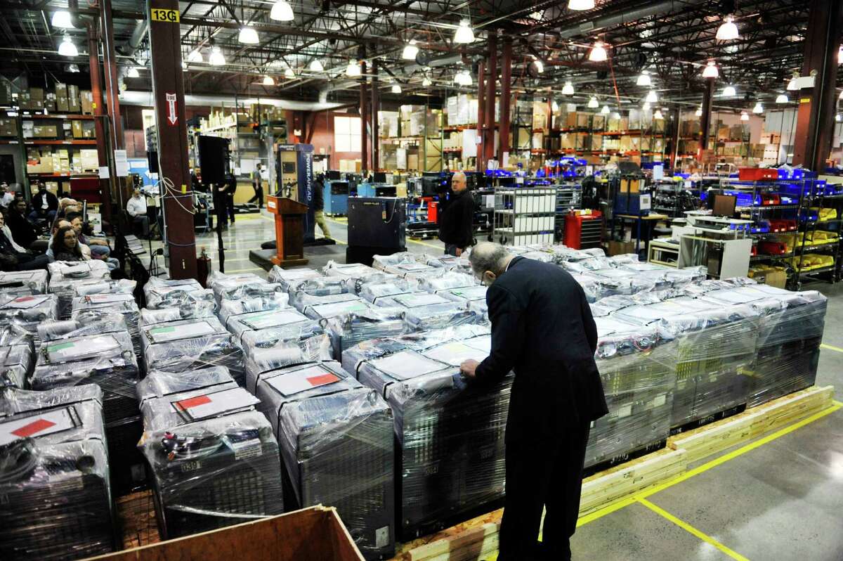 Senator Charles E. Schumer looks over rows of Plug Power GenDrive fuel cells during a tour of the company on Monday, Feb. 1, 2016, in Latham, N.Y. (Paul Buckowski / Times Union)