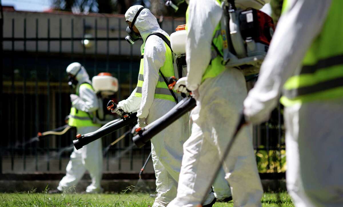 A fumigation brigade sprays an area of Chacabuco Park in a Aedes mosquito control effort, in Buenos Aires, Argentina, Wednesday, Jan. 27, 2016. Zika virus is spread by the same Aedes mosquito as dengue fever and chikunguya. The U.S. Centers for Disease Control says researchers have found strong evidence of a possible link between Zika and a surge of birth defects in Brazil.