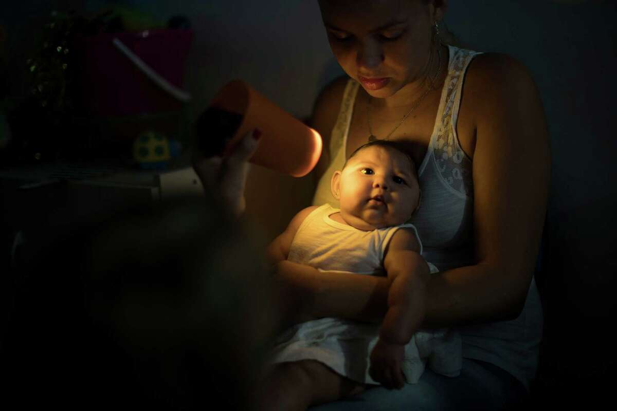 Gleyse Kelly da Silva holds her daughter Maria Giovanna, who was born with microcephaly, as she undergoes visual exams at the Altino Ventura foundation in Recife, Brazil, Thursday, Jan. 28, 2016. Brazilian officials still say they believe there's a sharp increase in cases of microcephaly and strongly suspect the Zika virus, which first appeared in the country last year, is to blame. The concern is strong enough that the U.S. Centers for Disease Control and Prevention this month warned pregnant women to reconsider visits to areas where Zika is present.