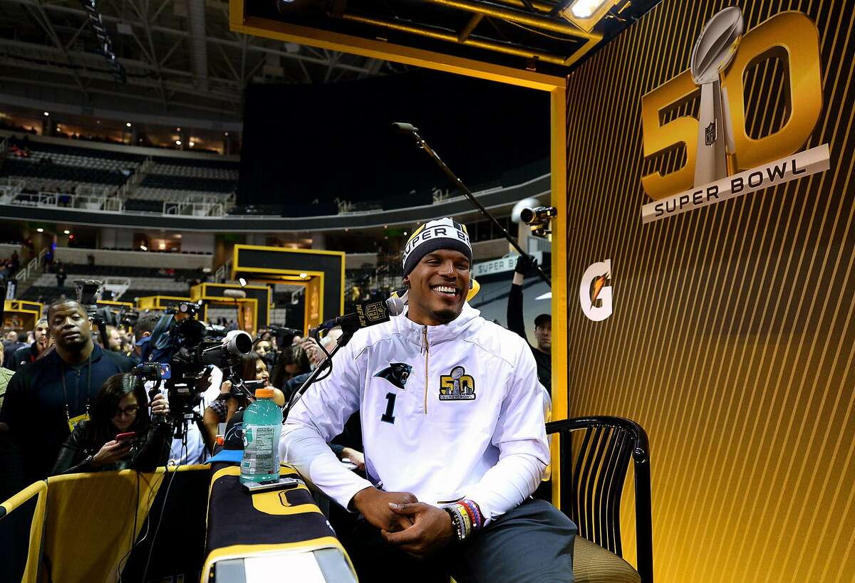 Carolina Panthers quarterback Cam Newton smiles while being asked if he could come up with a nickname for a comedian during the Super Bowl Opening Night at SAP Center in San Jose, Calif., on Monday, Feb. 1, 2016. (Jeff Siner/Charlotte Observer/TNS)