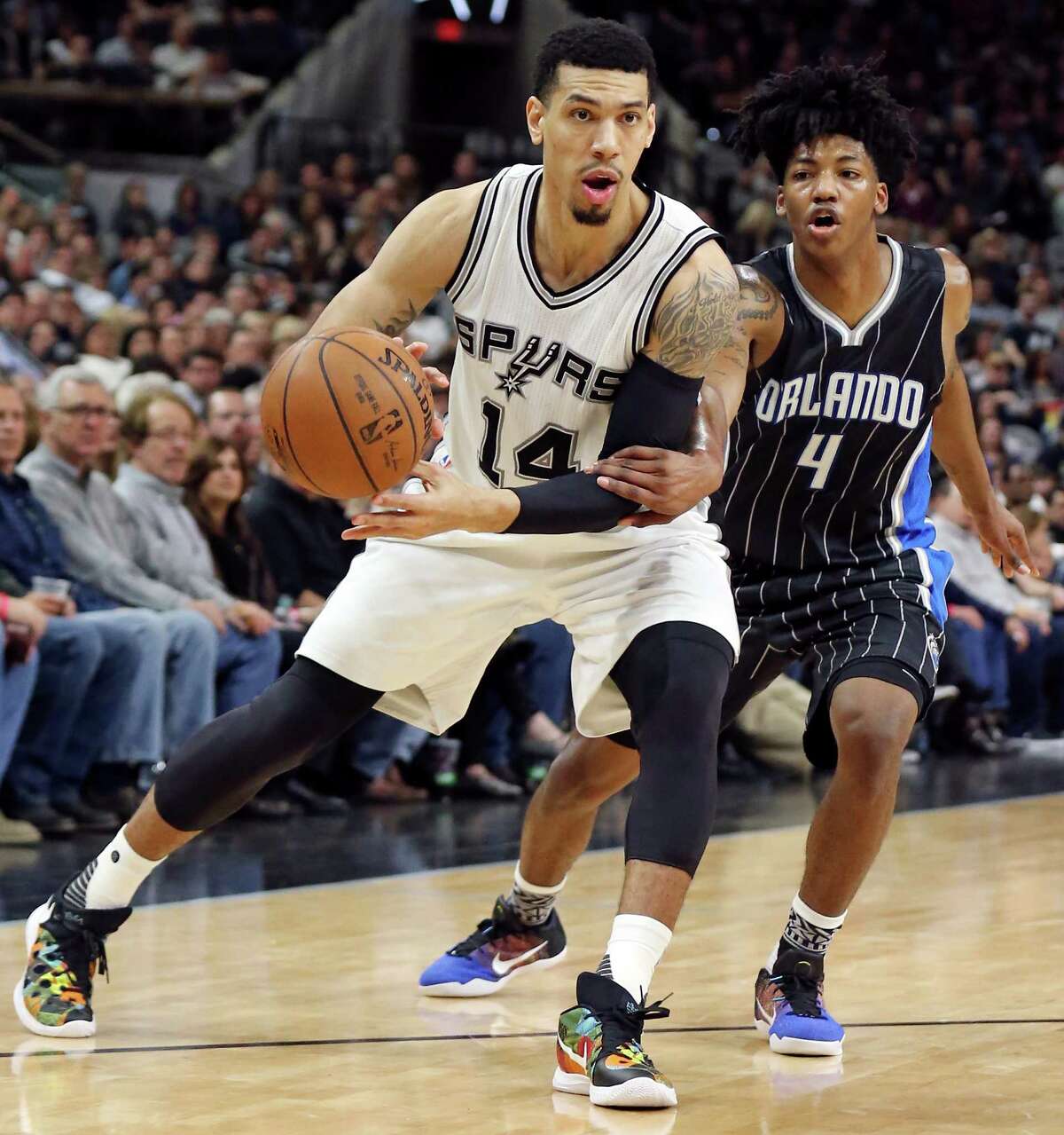 San Antonio Spurs' Danny Green looks for room around Orlando Magic's Elfrid Payton during second half action Monday Feb. 1, 2016 at the AT&T Center. The Spurs won 107-92.