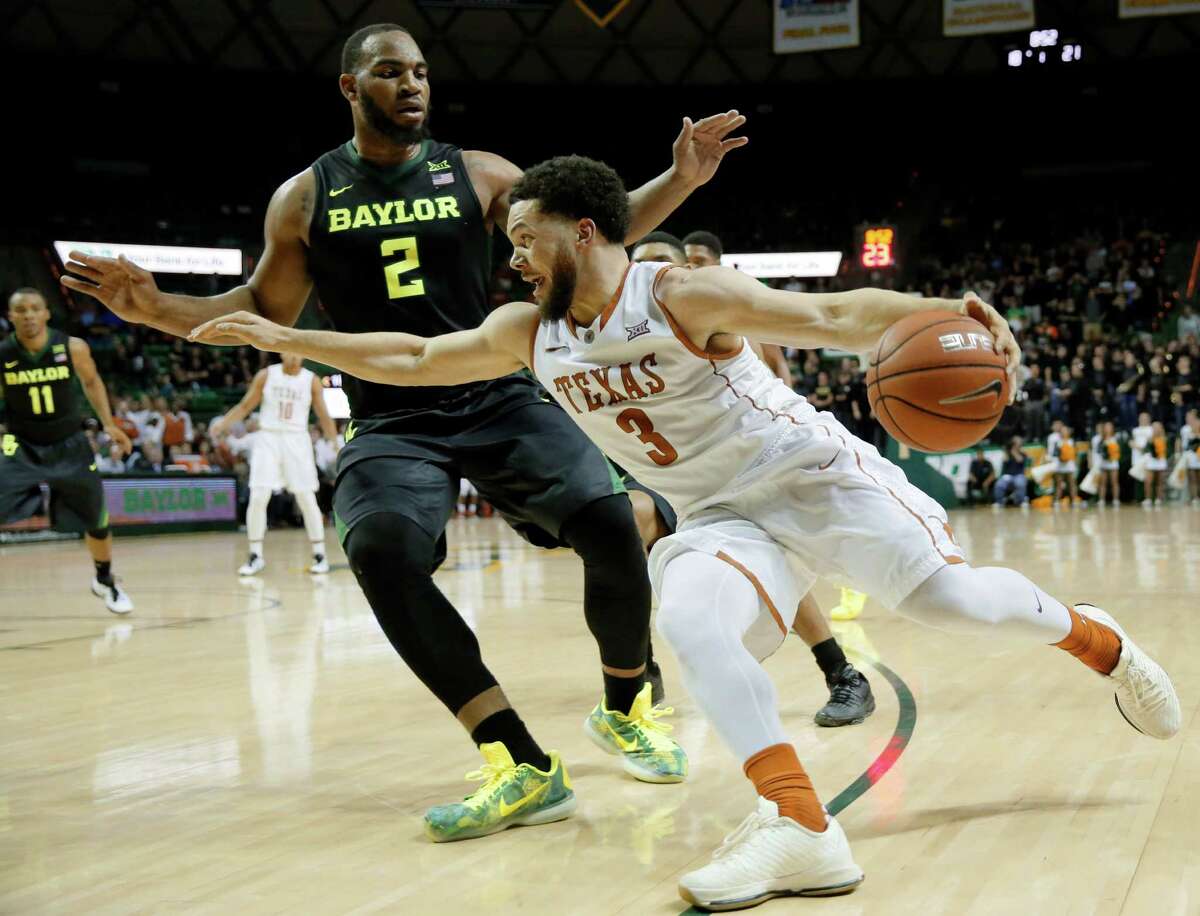 Texas guard Javan Felix (3) drives past Baylor's Rico Gathers (2) on his way to the basket in the first half of an NCAA college basketball game, Monday, Feb. 1, 2016, in Waco, Texas. (AP Photo/Tony Gutierrez)