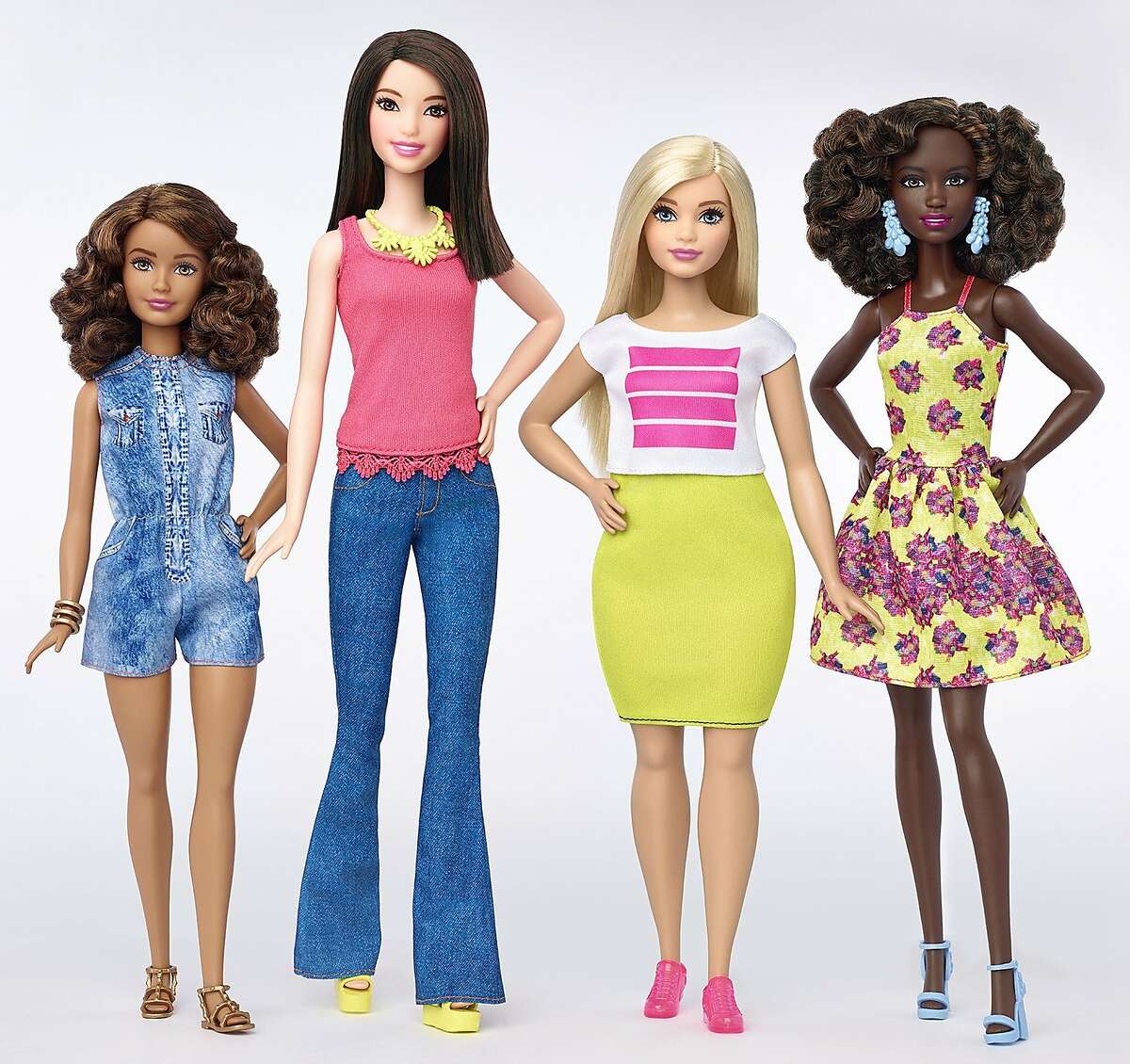 FILE - This file photo provided by Mattel shows a group of new Barbie dolls introduced in January 2016. Mattel reports financial results Monday, Feb. 1, 2016. (Mattel via AP, File)