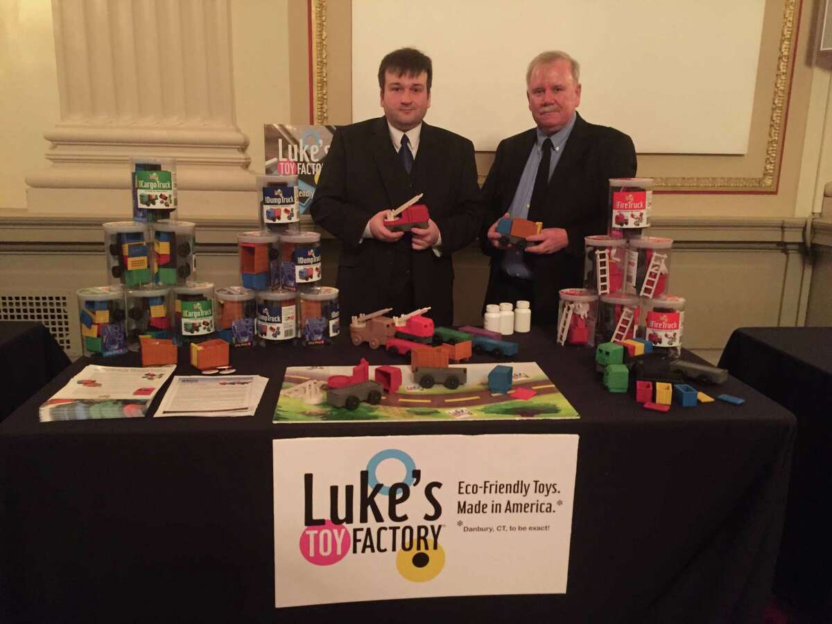 Luke Barber, left, and his father, James Barber, right, the founders of Danbury based Luke's Toy Factory attend a Small Business Development Center event this week in Washington D.C. Their company was one of less than a dozen from throughout the United States who were invited to attend the event.