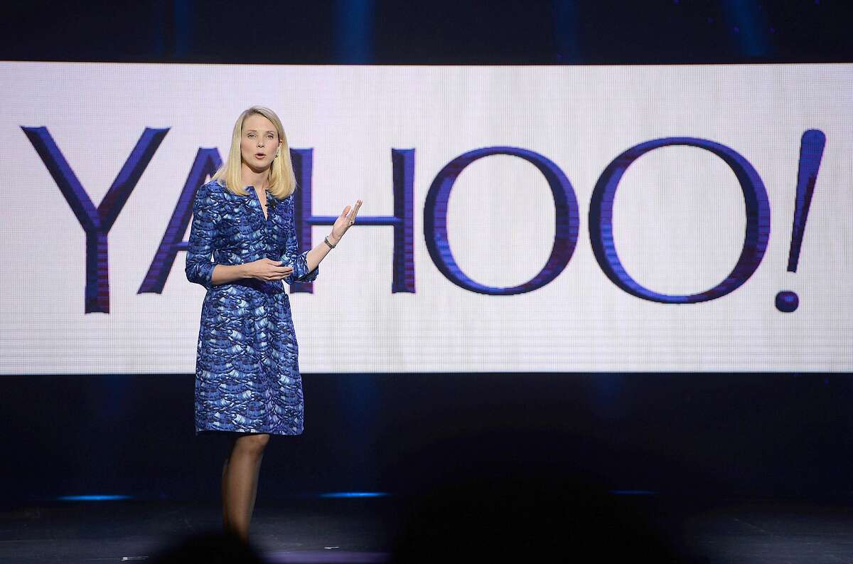 (FILES) This file photo taken on January 07, 2014 shows Yahoo CEO Marissa Mayer speaking during her keynote address at the 2014 International CES in Las Vegas, Nevada. Yahoo on February 2, 2016 said it is cutting 15 percent of its workforce and narrowing its focus as it explores "strategic alternatives" for what to do with the faded Internet star. The announcements came as the California company reported a loss of $4.43 billion in the final three months of last year, due mostly to lowering the value of its US, Canada, Europe, Latin America and Tumblr units. / AFP / ROBYN BECKROBYN BECK/AFP/Getty Images