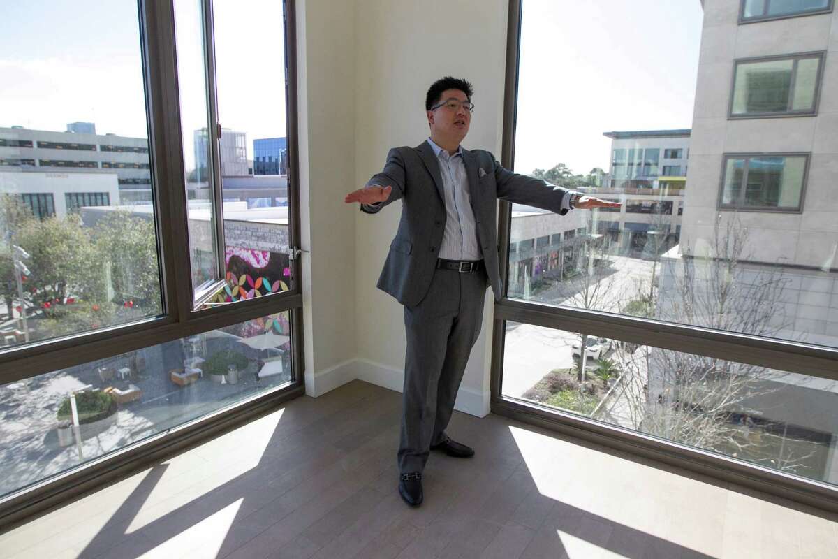 Tommy KU shows a corner apartment in the Grey House, Houston's newest luxury apartment complex, 4444 Westheimer Road, Wednesday, Feb. 3, 2016, in Houston. The property is within the mixed-use River Oaks District development near the Galleria. ( Steve Gonzales / Houston Chronicle )