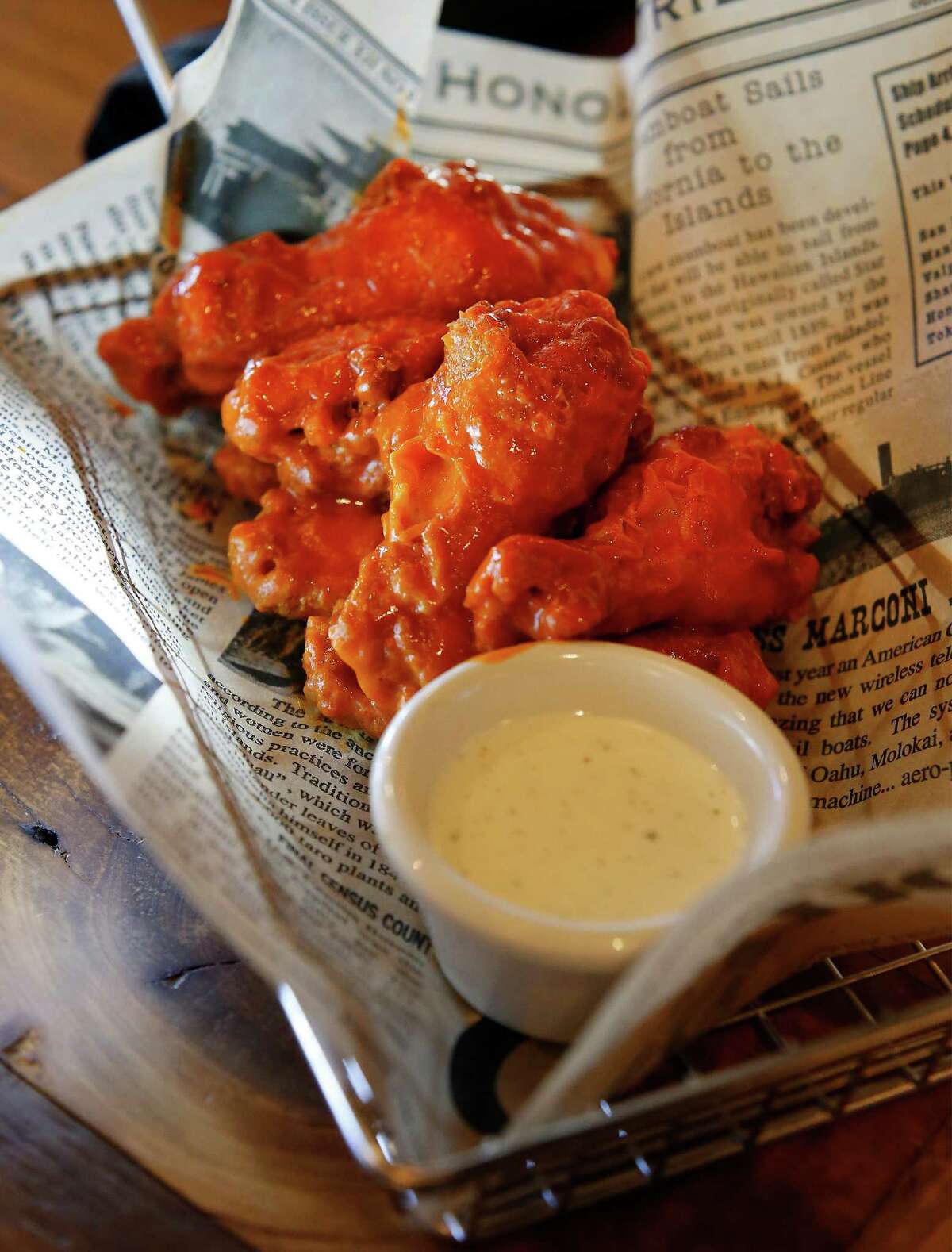 Wings are offered with a choice of sauces. Avoid the too-sweet moonshine barbecue sauce and go for the hot wing sauce.