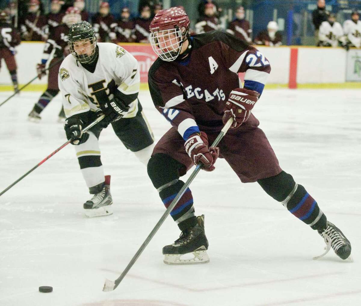 FILE PHOTO: Brookfield/Bethel/Danbury's Luke Newman picks up the puck during a game against Joel Barlow High School, played at the Danbury Ice Arena. Monday, Feb. 1, 2016