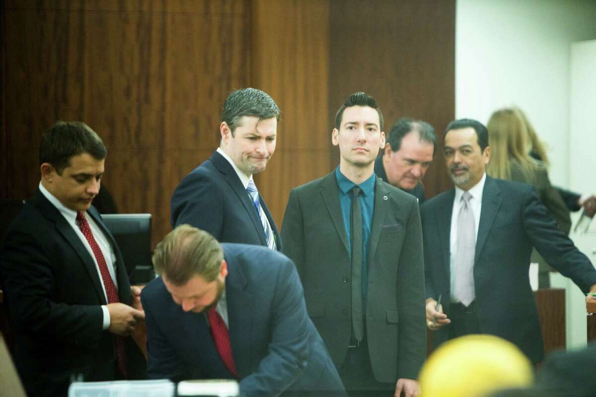 David Daleiden, center, shows up to the Harris County Criminal Court with his legal, Thursday, Feb. 4, 2016, in Houston.