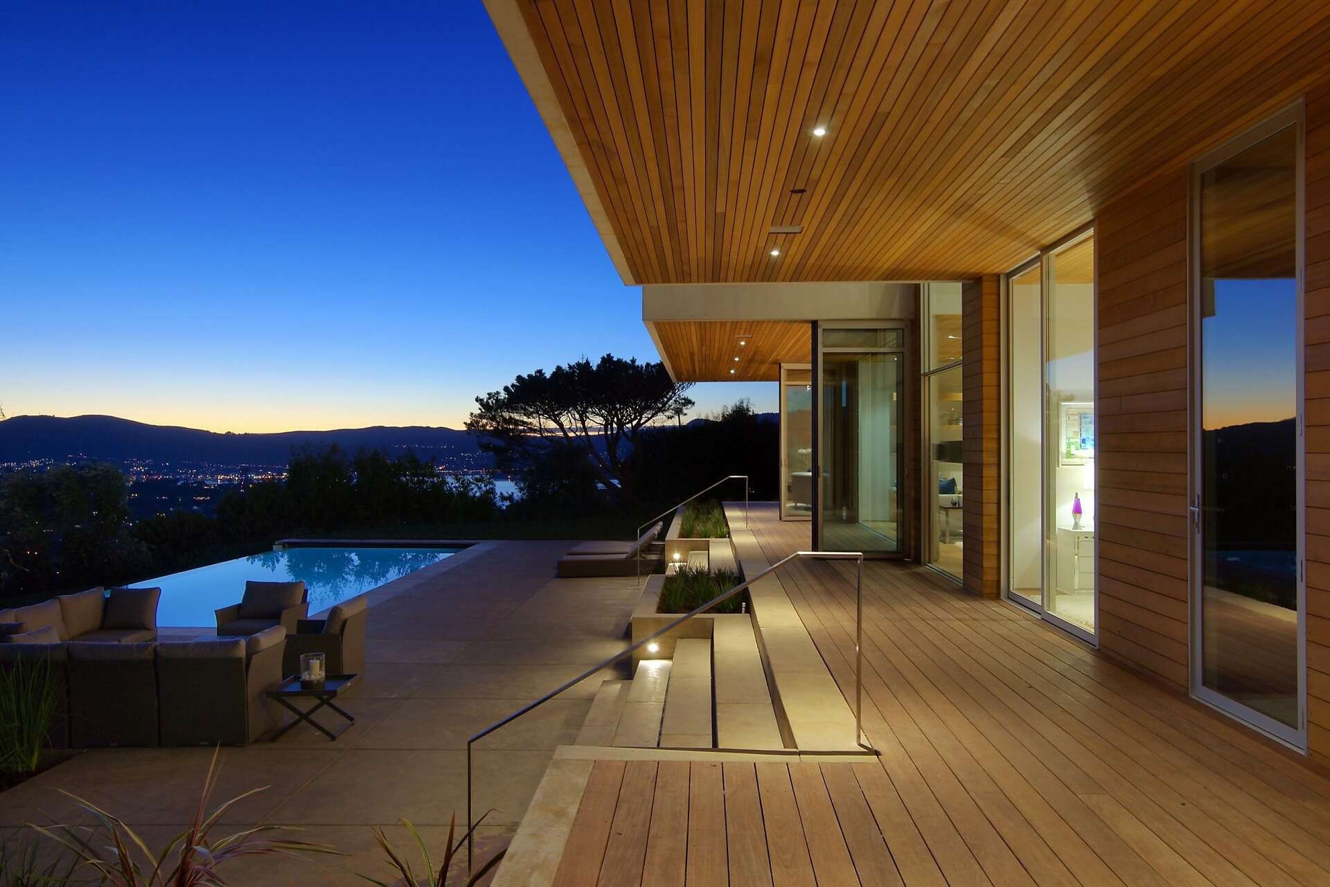 Retractable glass walls create exemplary indoor/outdoor living in Tiburon