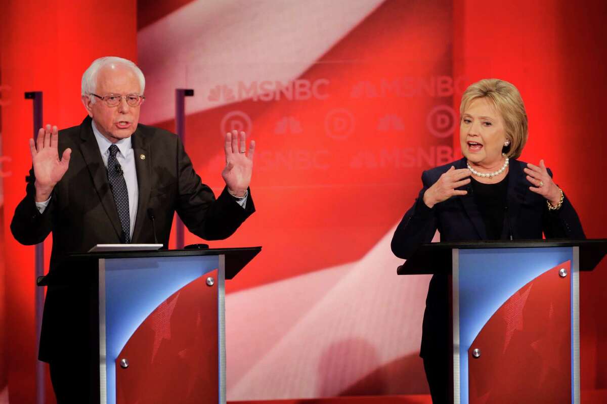 Democratic presidential candidate, Sen. Bernie Sanders, I-Vt, and Democratic presidential candidate, Hillary Clinton spar during a Democratic presidential primary debate hosted by MSNBC at the University of New Hampshire Thursday, Feb. 4, 2016, in Durham, N.H.