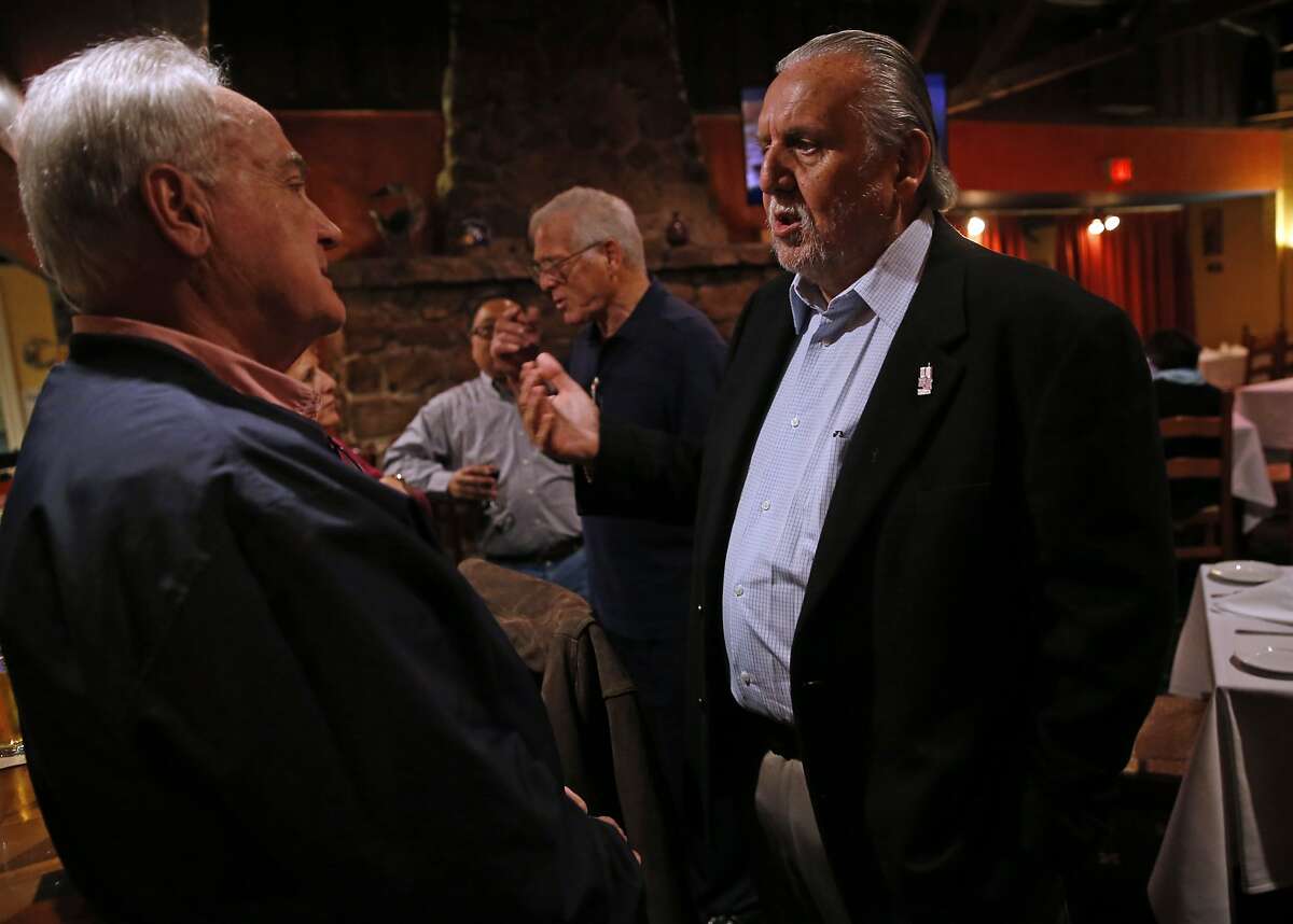 Photographers Mickey Palmer (right) and John Biever chat before they are celebrated at a dinner honoring their 50th Super Bowl as photographers in Half Moon Bay, Calif., on Thursday, February 4, 2016.