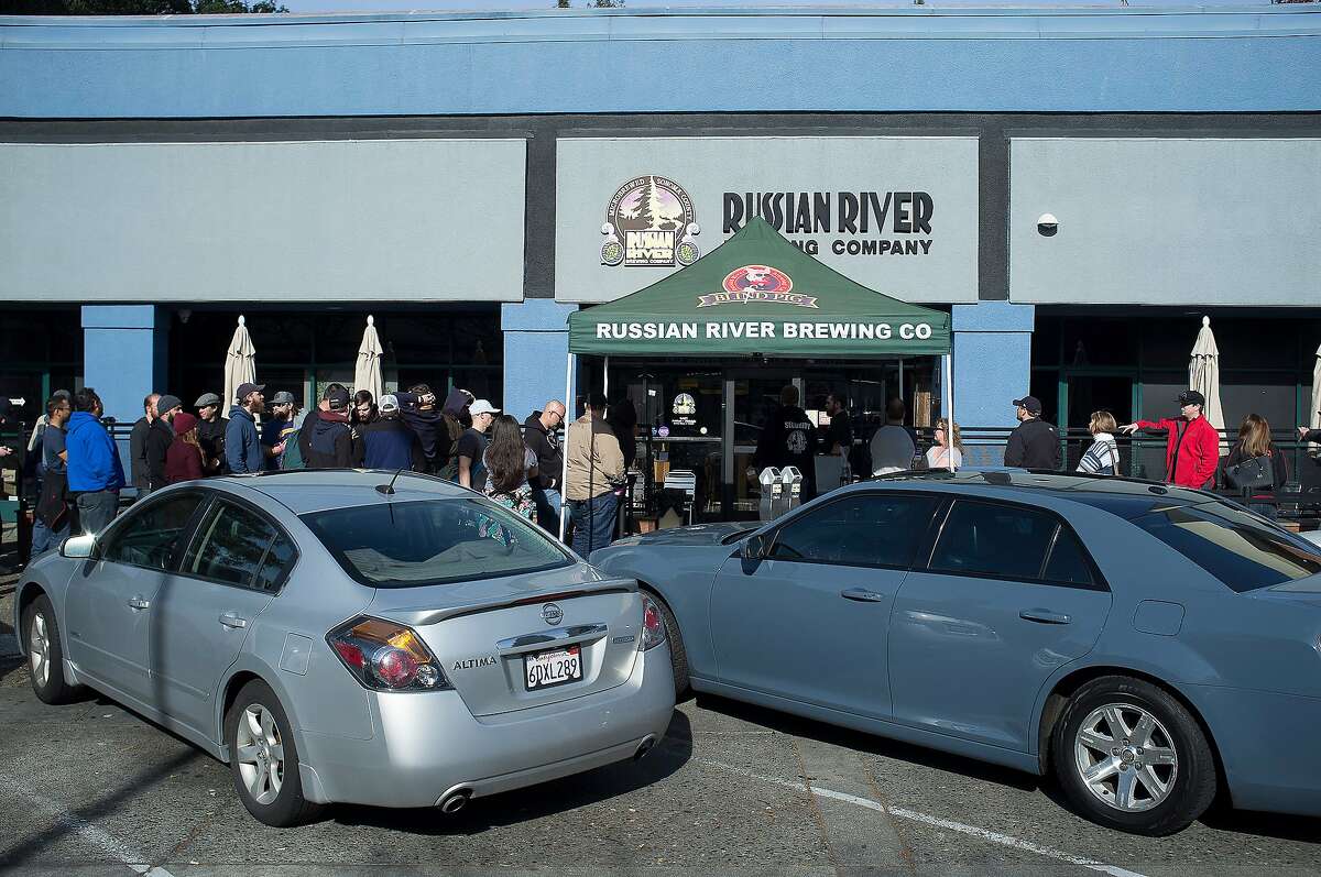 Customers line up for blocks during the unveiling of the Pliny The Younger beer at the Russian River Brewing Company in Santa Rosa, Calif. on Friday, Feb. 5, 2016