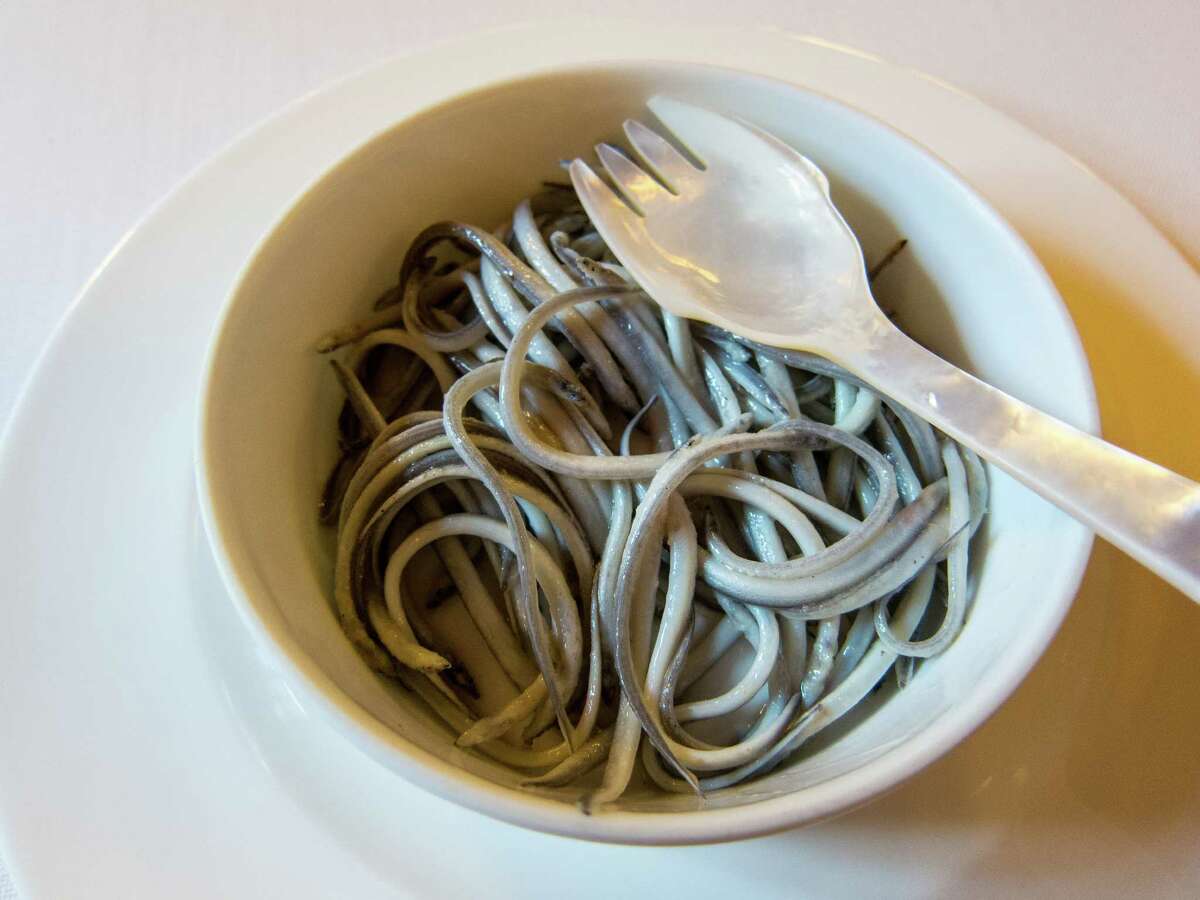 Baby eels, known as angulas, are ﻿considered a delicacy in Basque cuisine. They are eaten with a wooden or mother-of-pearl, shown, utensil.