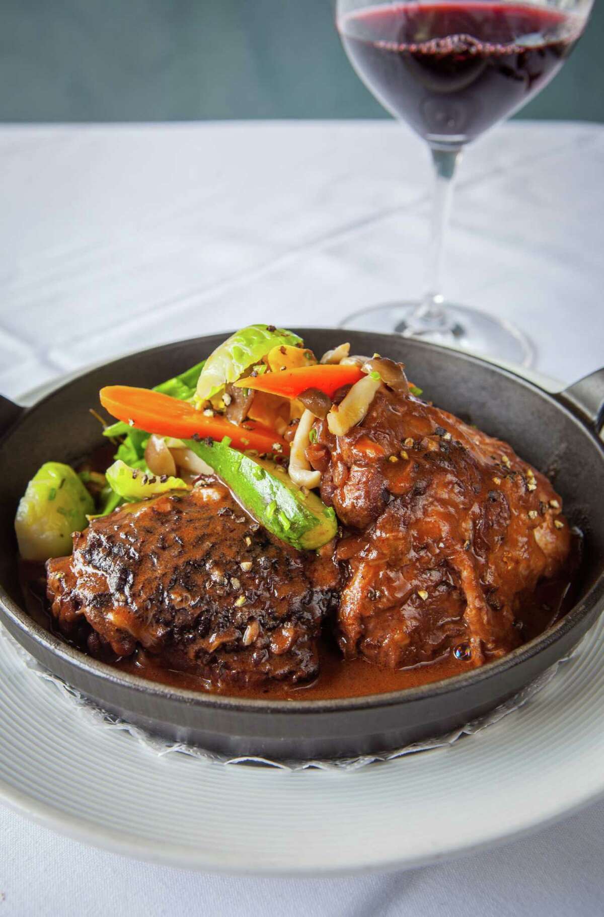 Etoile Cuisine et Bar: Coq au Vin, chicken braised in red wine with creamy potatoes and spring vegetables. Etoile's coq au vin, chicken braised in red wine, creamy potatoes, spring vegetables.