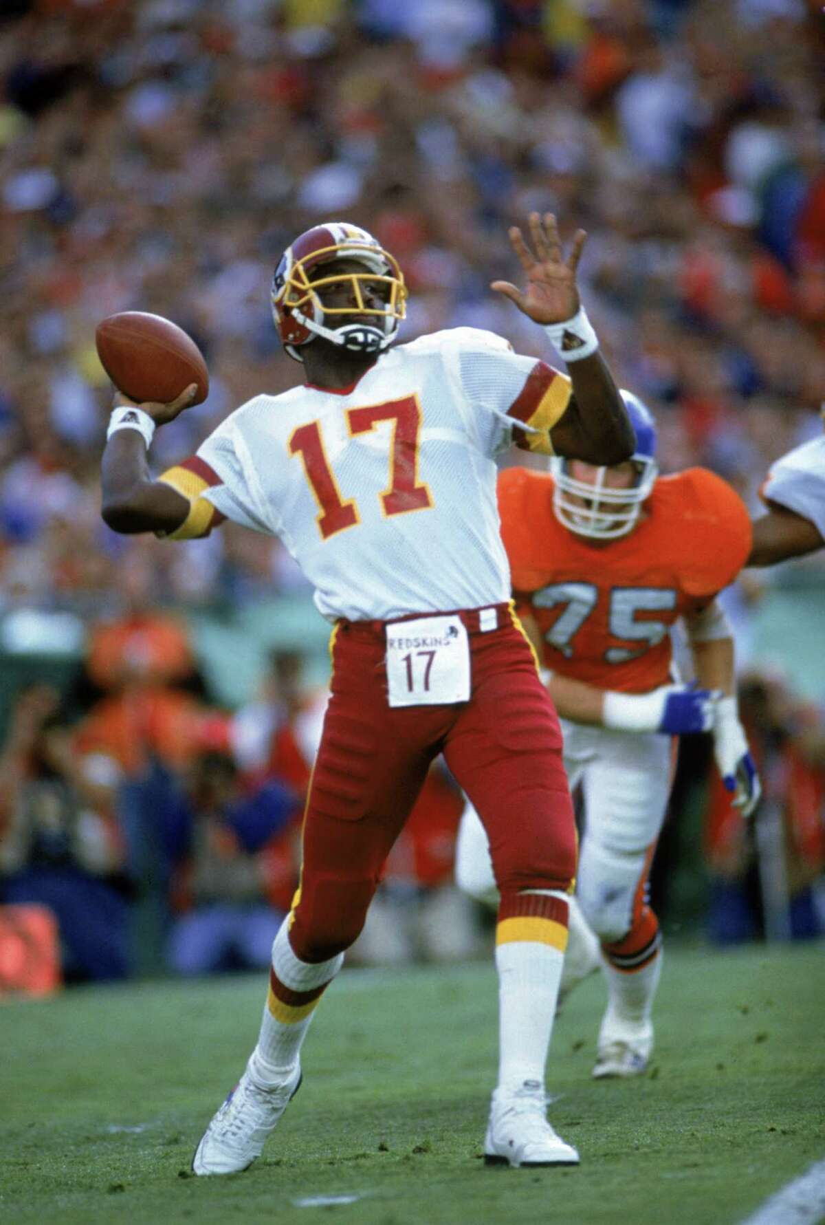 Doug Williams of the Washington Redskins throws a pass against the Denver Bronces during Super Bowl XXII at Jack Murphy Stadium on Jan. 31, 1988 in San Diego. The Redskins defeated the Broncos 42-10.