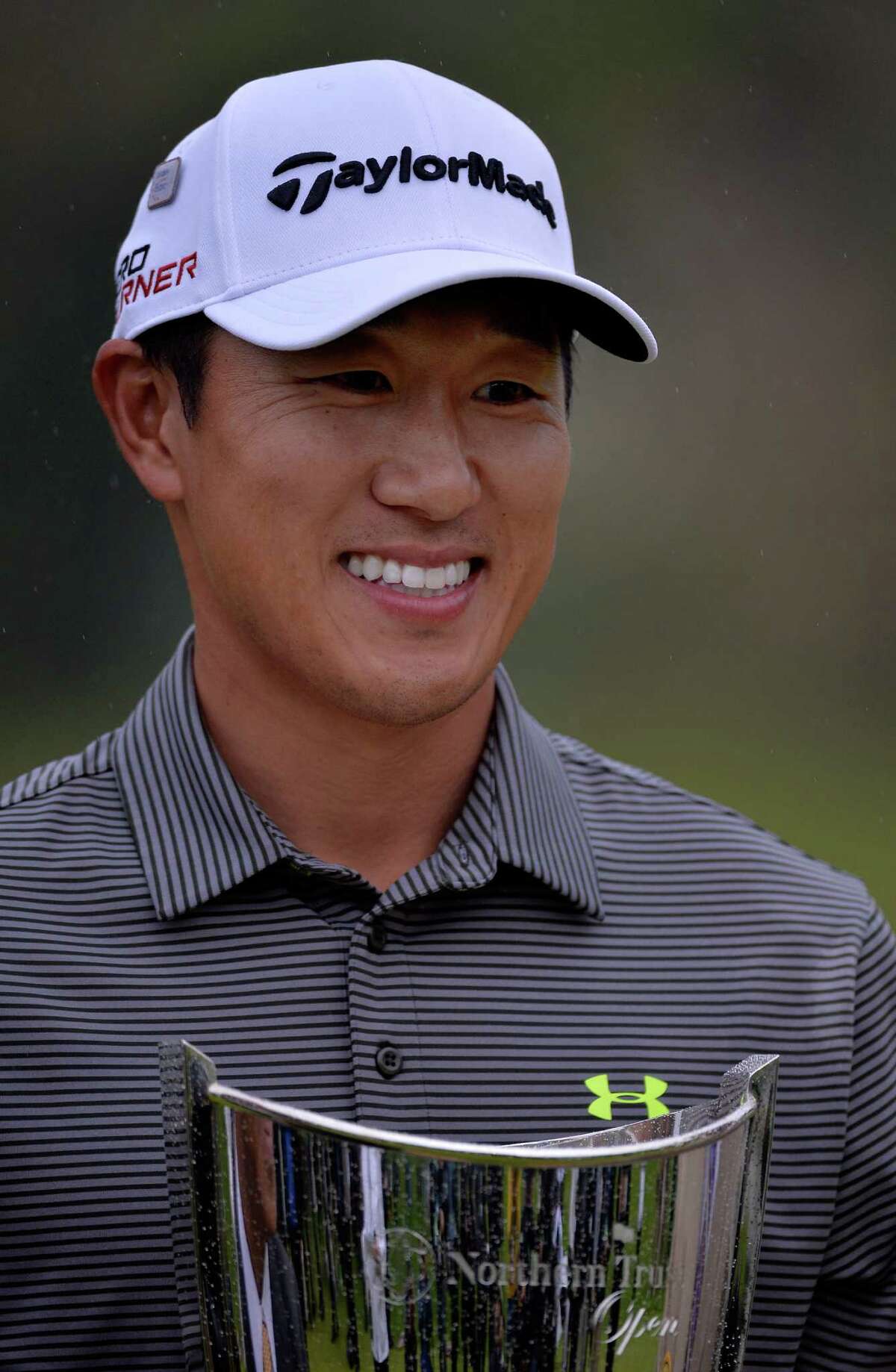 PACIFIC PALISADES, CA - FEBRUARY 22: James Hahn holds the trophy on the 18th hole after putting in for the win on the 14th hole during the third round playoff during the Final Round of the Northern Trust Open at the Riviera Country Club on February 22, 2015 in Pacific Palisades, California. (Photo by JD Cuban/Getty Images)