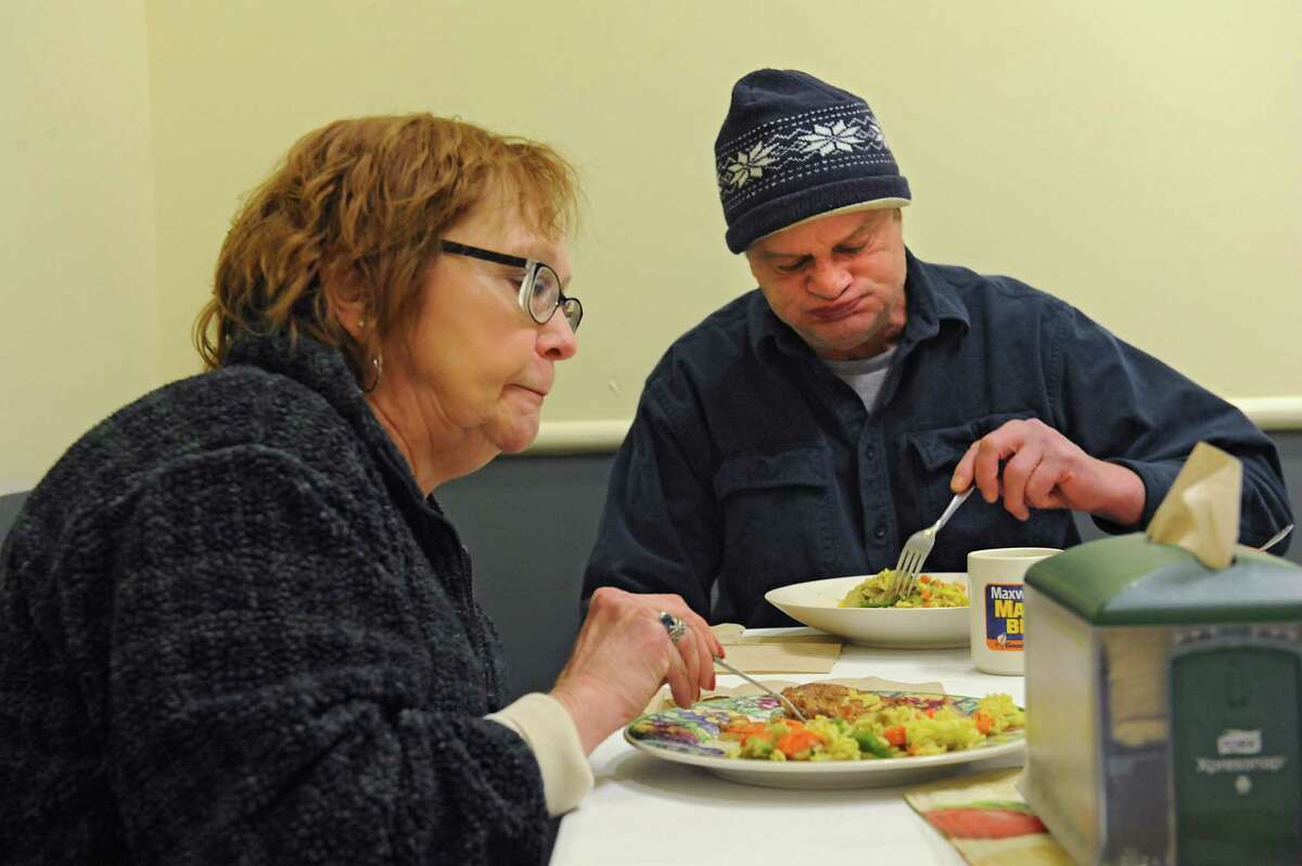 Judith Smith and Gary Welch, both homeless, eat a hot meal at Joseph's House & Shelter on Thursday, Jan. 28, 2016 in Troy, N.Y. (Lori Van Buren / Times Union)