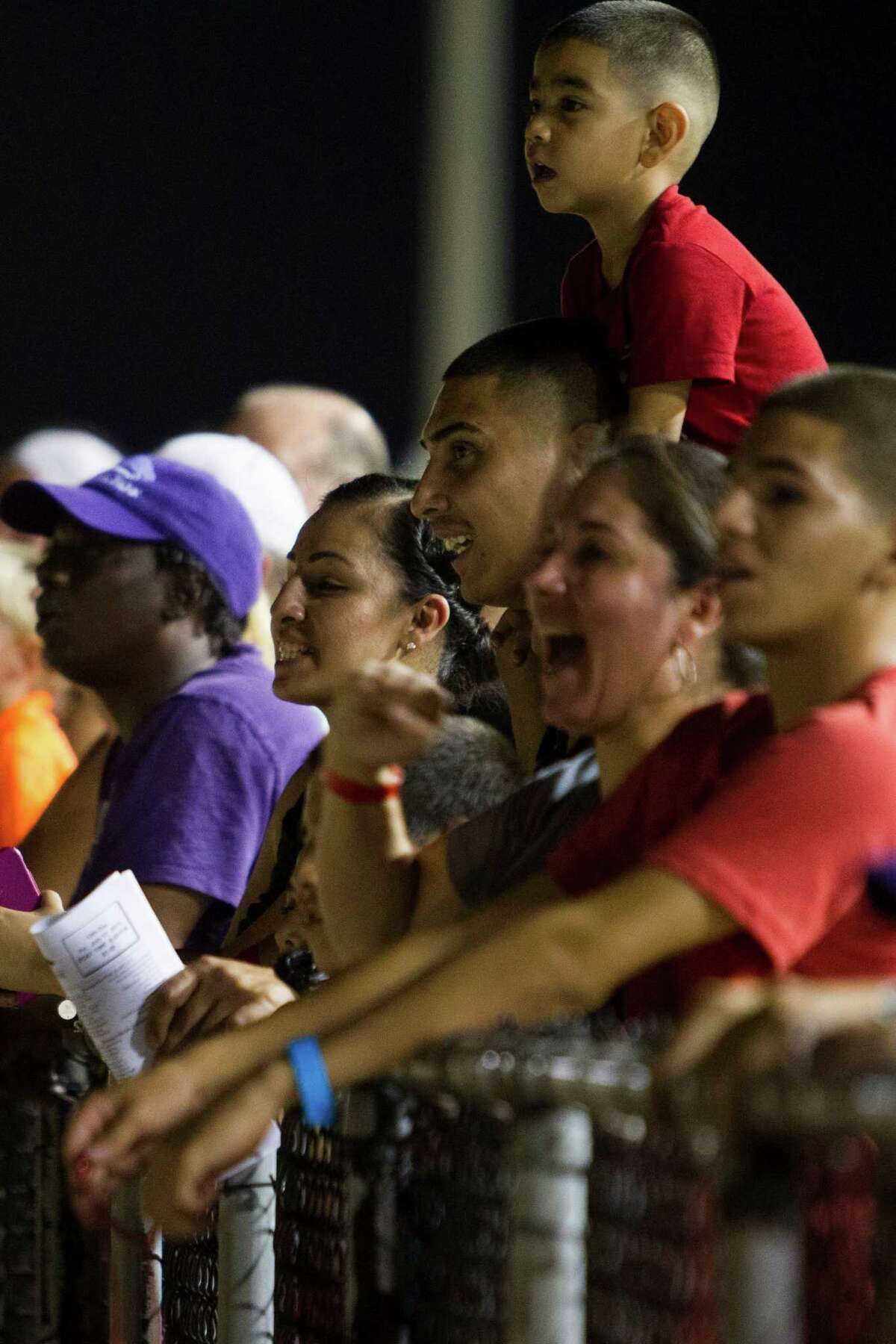 Fans watch the eighth race at Retama Park in Selma, Texas on July 17, 2015.