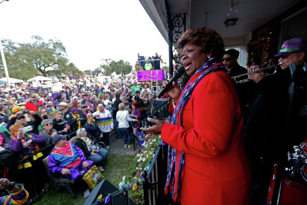 Grammy Award-winning recording artist Irma Thomas, known as the "Soul Queen of New Orleans," performs on the front porch of a home on Orleans Avenue as crowds wait for the Krewe of Endymion Mardi Gras parade to pass Saturday in New Orleans.