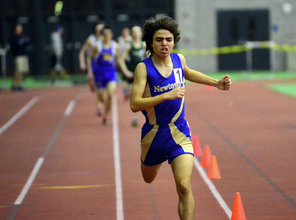 Newtown's Christian Lestik crosses the finish line in the 1000 meter run during SWC Girls and Boys Track Championship action in New Haven, Conn., on Saturday Feb. 6, 2016.