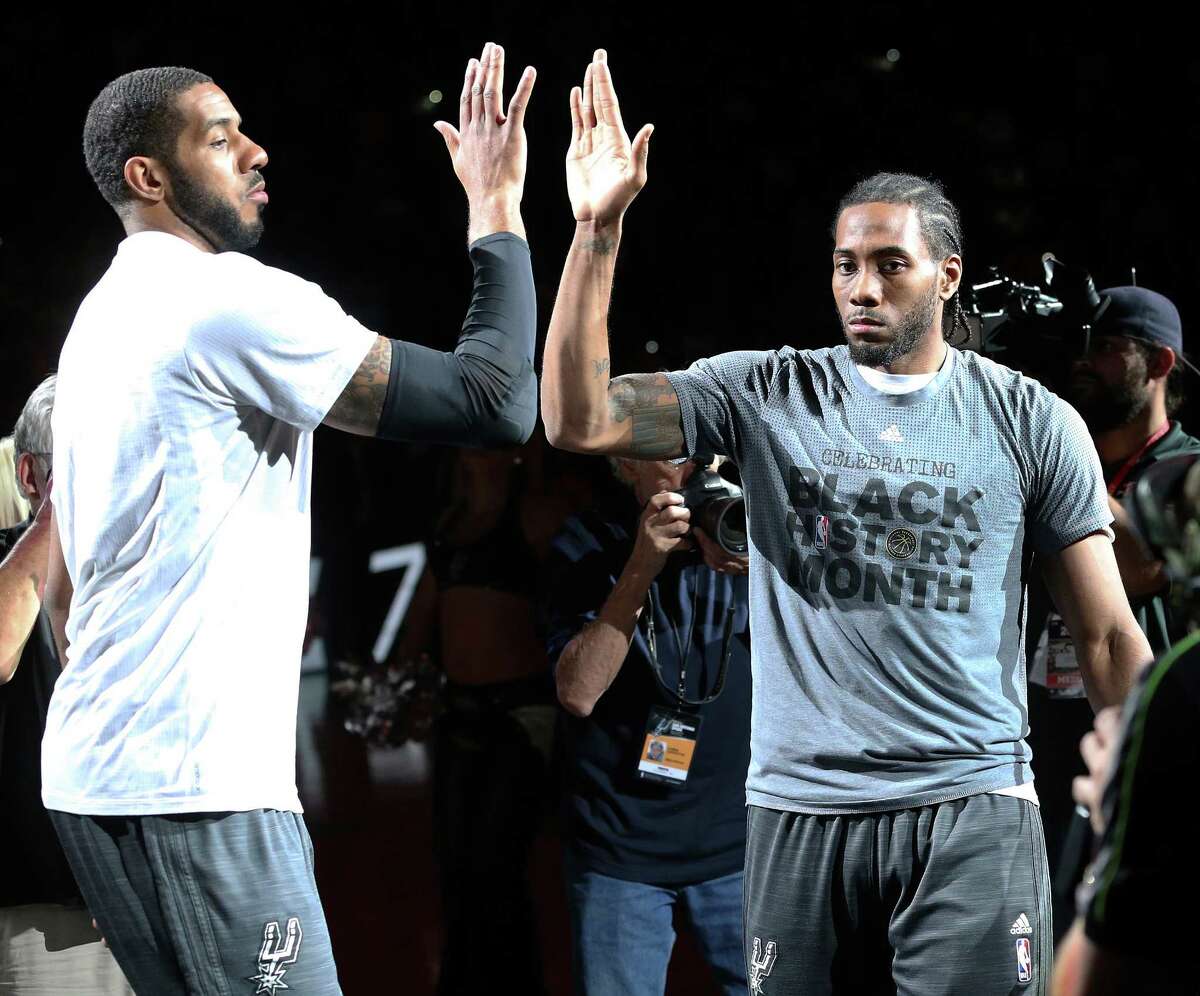 LaMarcus Aldridge and Kawhi Leonard high five in the introductions as the Spurs host the Lakers at the AT&T Center on February 6, 2016.
