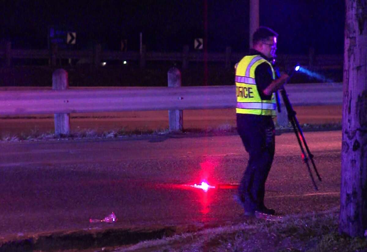 San Antonio Police investigate the scene on the West Side where an unknown woman was hit by a vehicle while attempting to cross a highway, Sunday, Feb. 7, 2016.