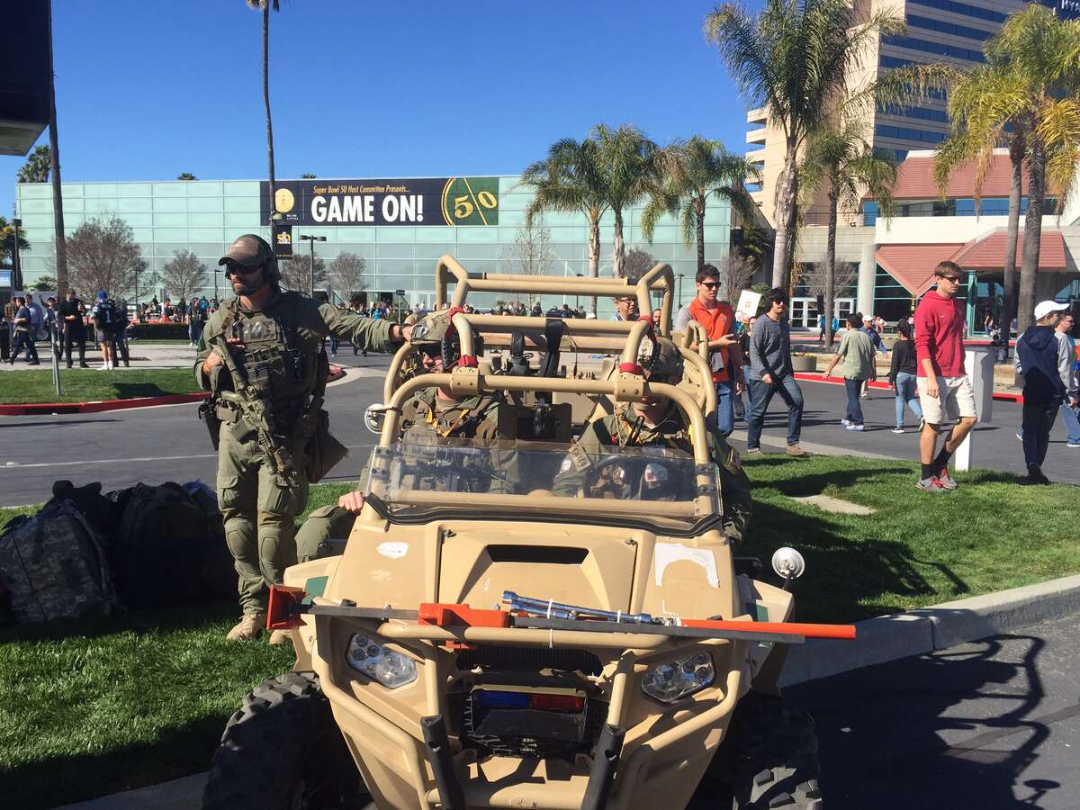 An off-roads military vehicle greets fans across the street from Levi’s Stadium in Santa Clara before Super Bowl 50.