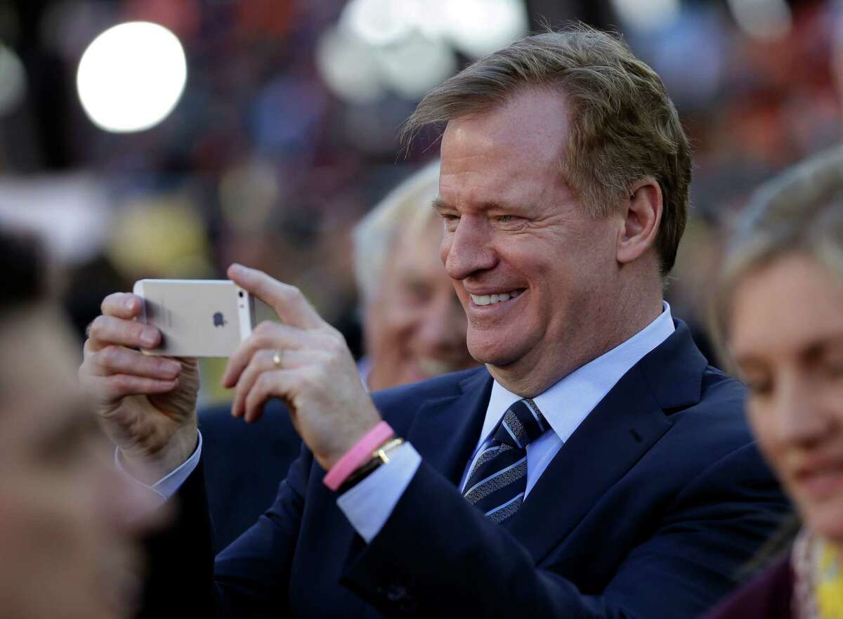 NFL commissioner Roger Goodell takes a picture before the NFL Super Bowl 50 football game between the Denver Broncos and the Carolina Panthers Sunday, Feb. 7, 2016, in Santa Clara, Calif. (AP Photo/David J. Phillip)
