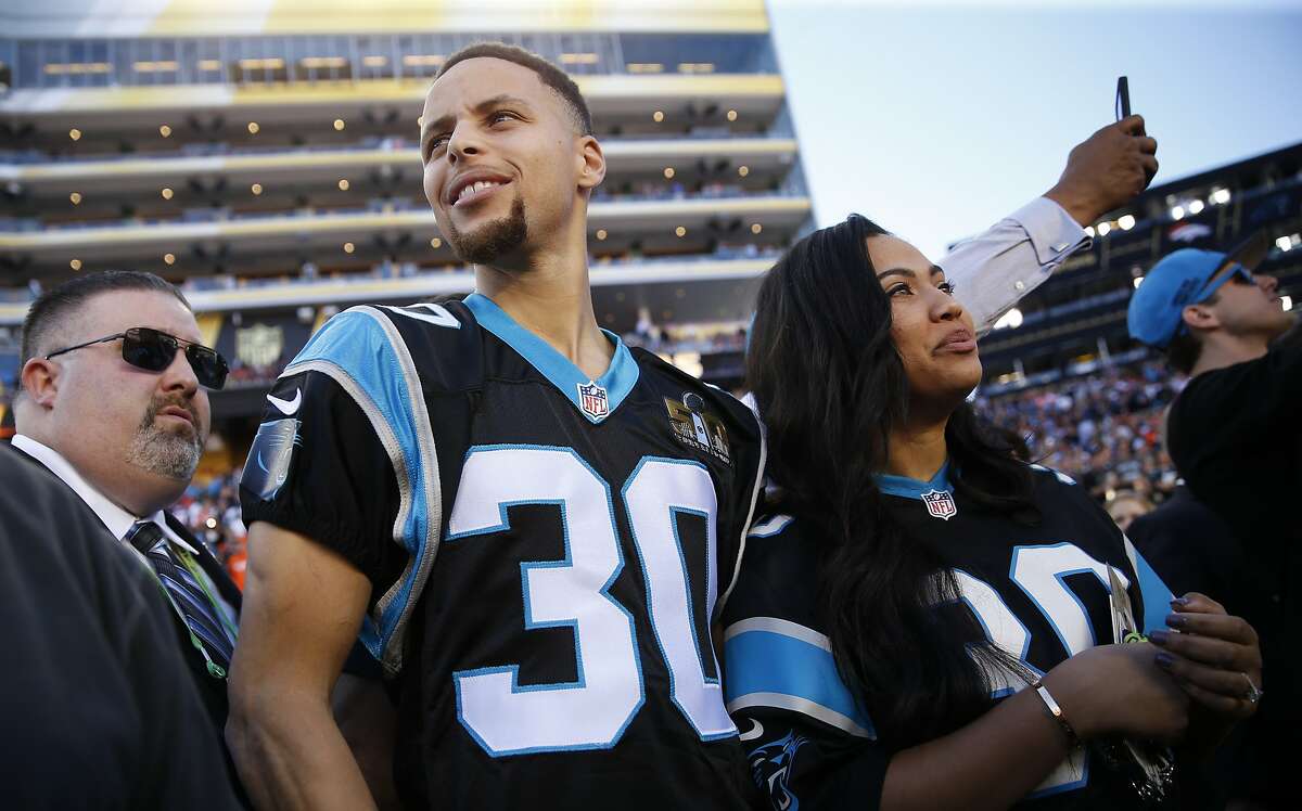 Stephen and Ayesha Curry are seen on the sideline before Super Bowl 50 between the Carolina Panthers and the Denver Broncos at Levi's Stadium on Sunday, Feb. 7, 2016 in Santa Clara, Calif.