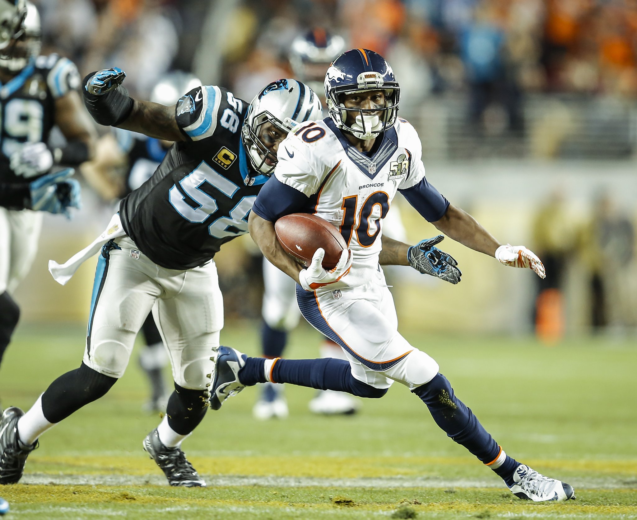 Denver Broncos tight end Owen Daniels and quarterback Peyton Manning  celebrate C.J. Anderson's two yard touchdown against the Carolina Panthers  in the fourth quarter of Super Bowl 50 in Santa Clara, California