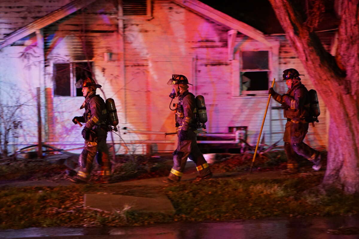 Neighbors rescued children from a house fire Sunday, Feb. 7, 2016, who were apparently home alone when the blaze started at a home in the 2300 block of North Navidad Street.