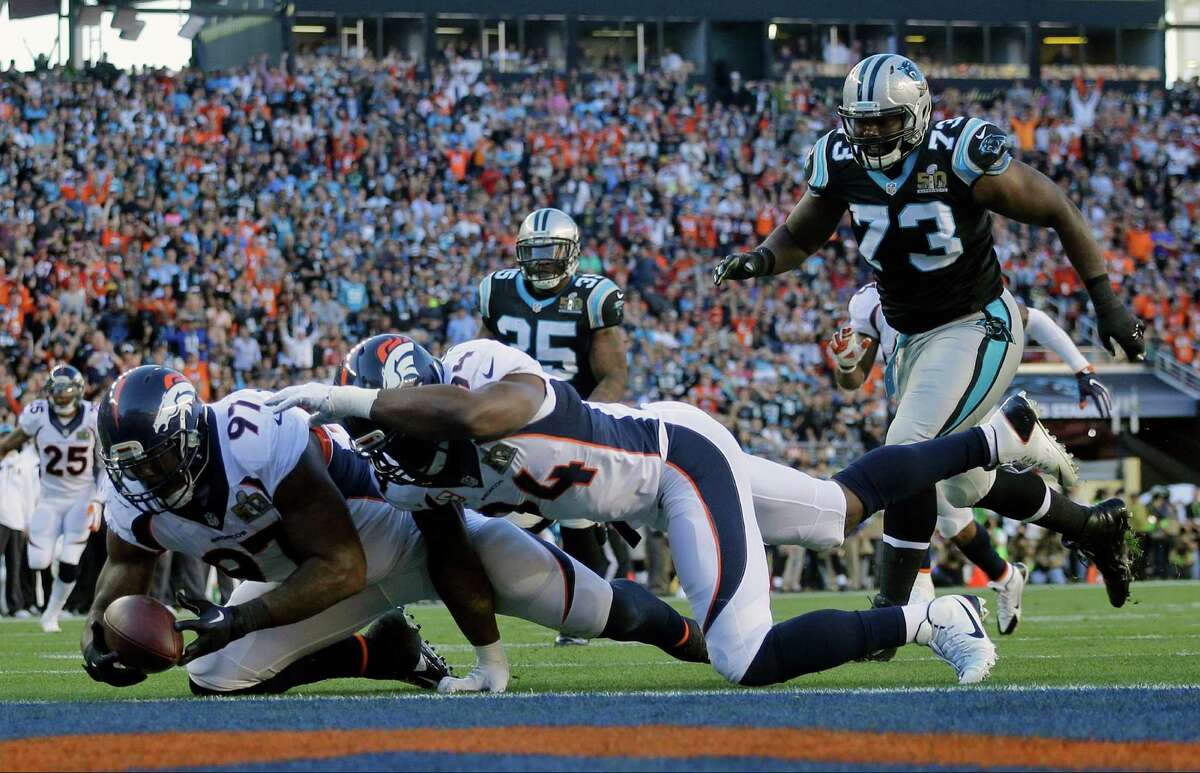 The Broncos' defense provides some offense as Malik Jackson scoops up a Cam Newton fumble for the first touchdown of the game.