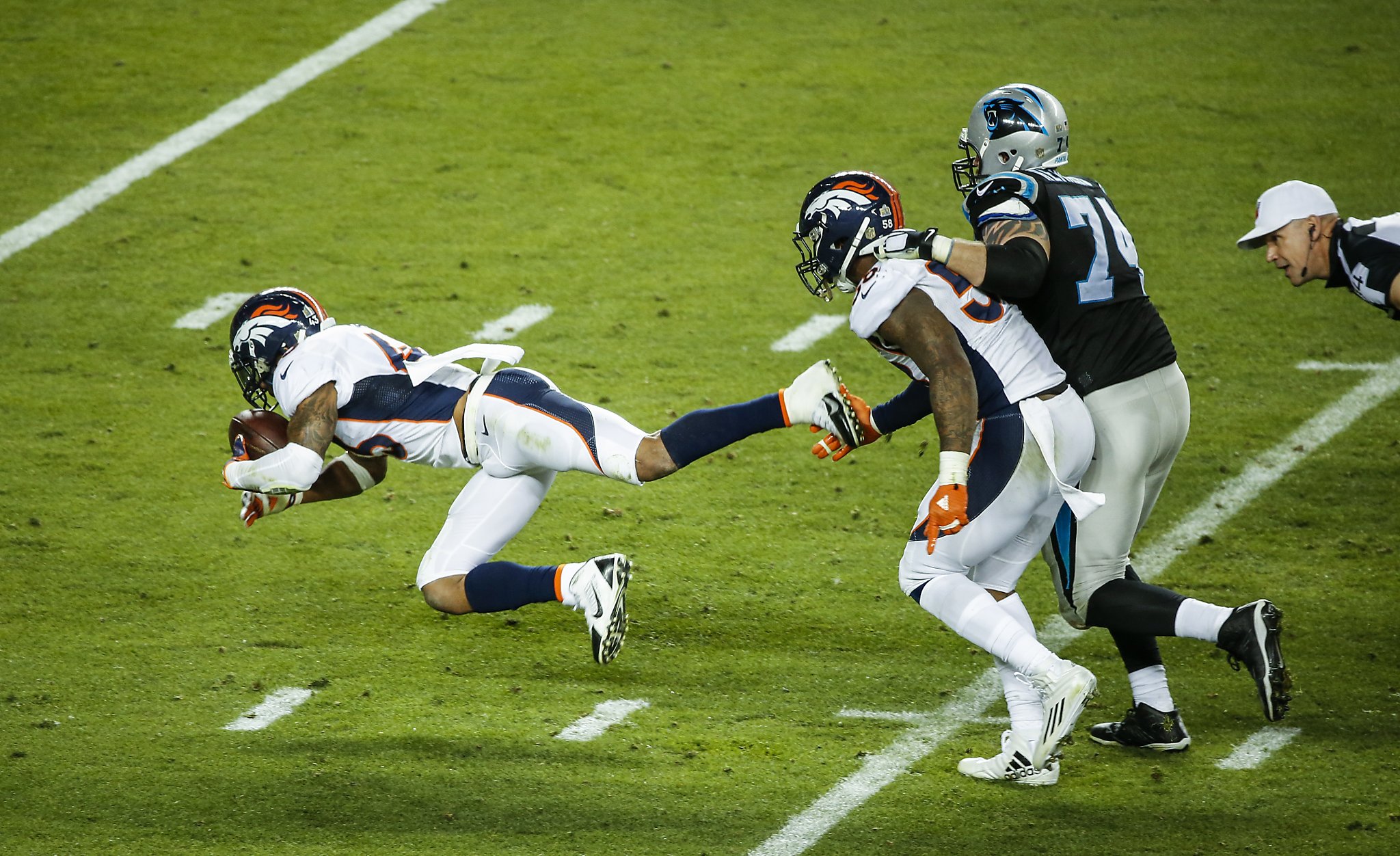 Denver Broncos (L-R) Malik Jackson, Aqib Talib, and T.J. Ward