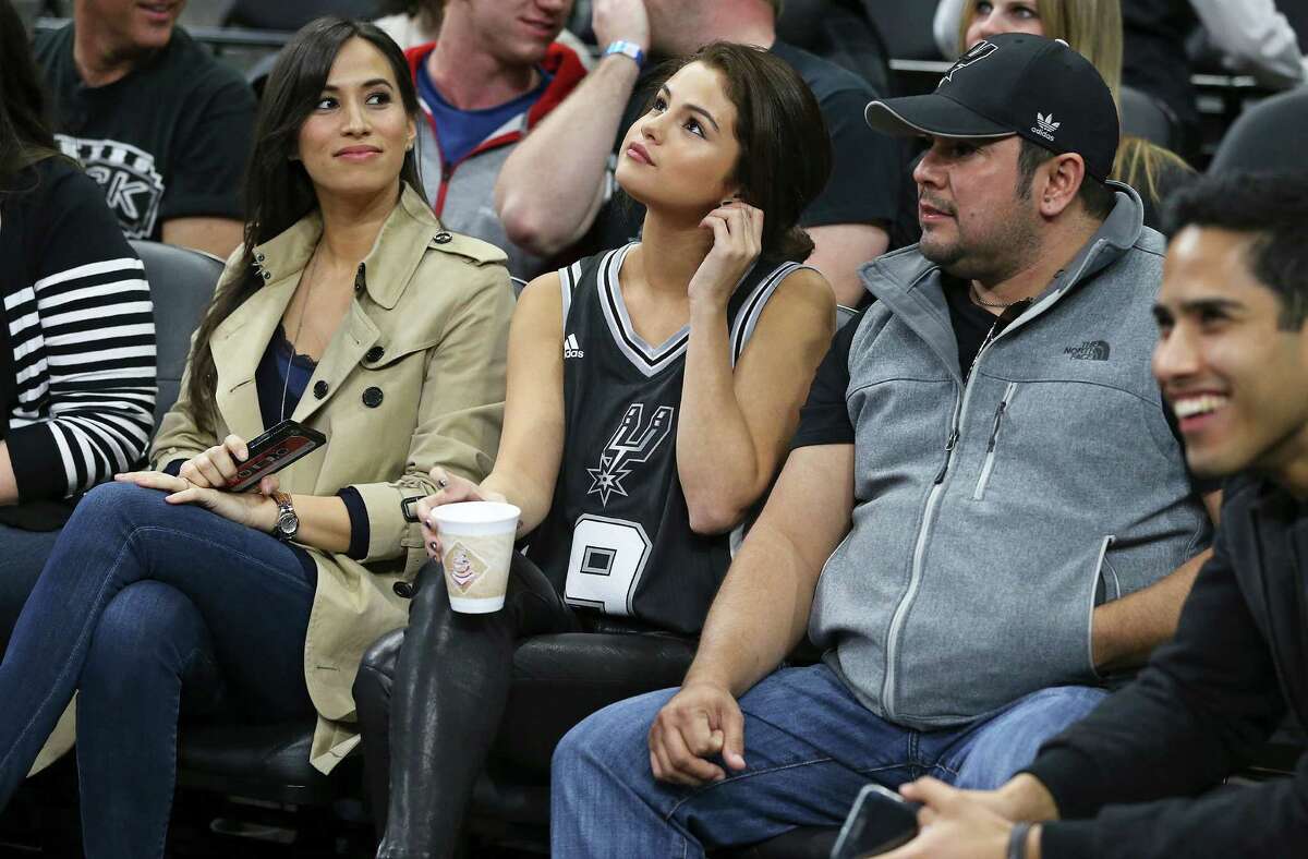 Selena Gomez sits with Tony Parker's wife as the Spurs host the Lakers at the AT&T Center on February 6, 2016.