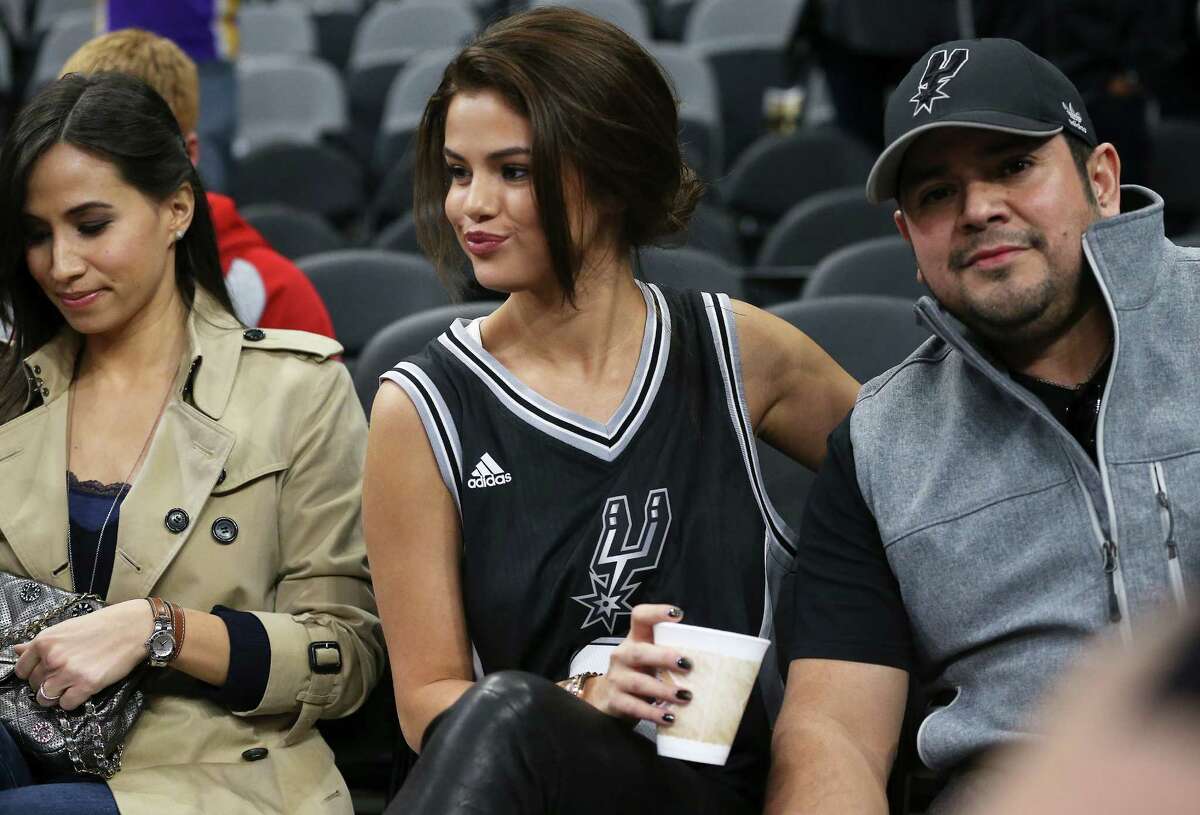 Selena Gomez sits with Tony Parker's wife as the Spurs host the Lakers at the AT&T Center on February 6, 2016.