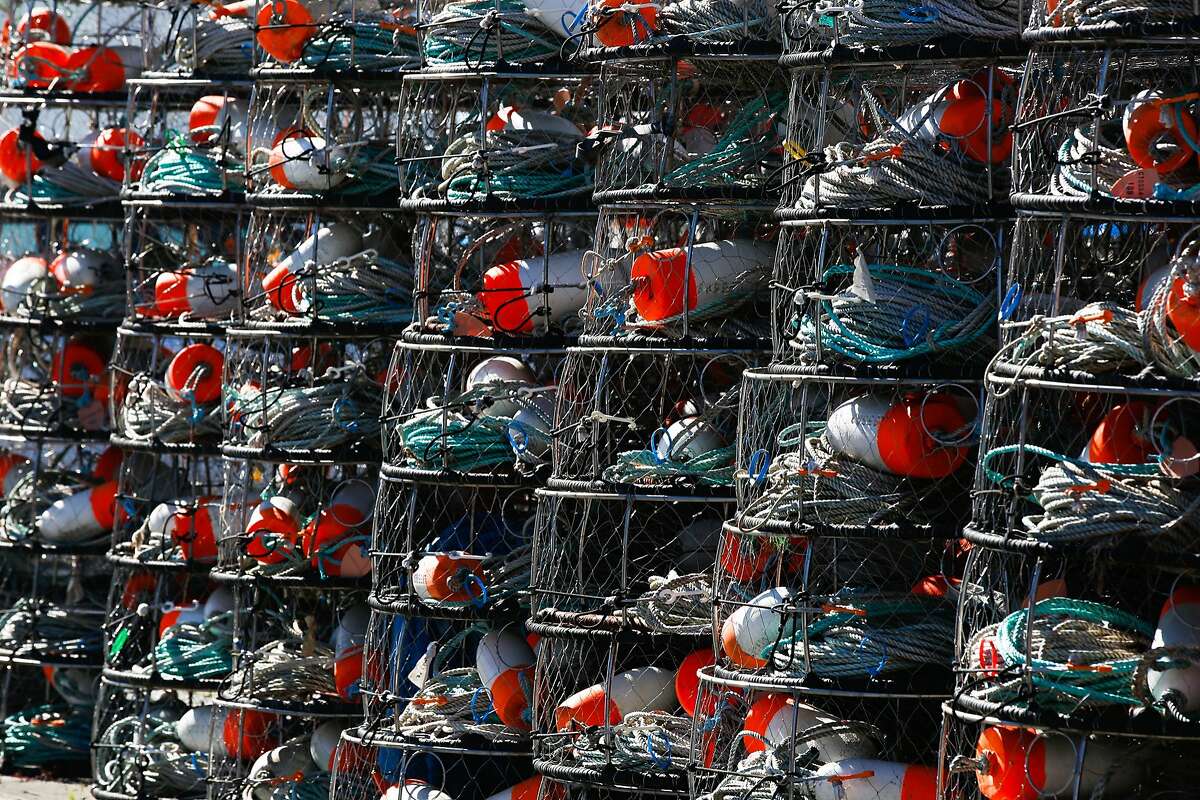 Crab fishing pots are stacked near the harbor in Santa Cruz, Calif. on Monday, February 8, 2016. The Small Business Administration is offering small disaster loans to businesses affected by the delayed dungeness crab season.