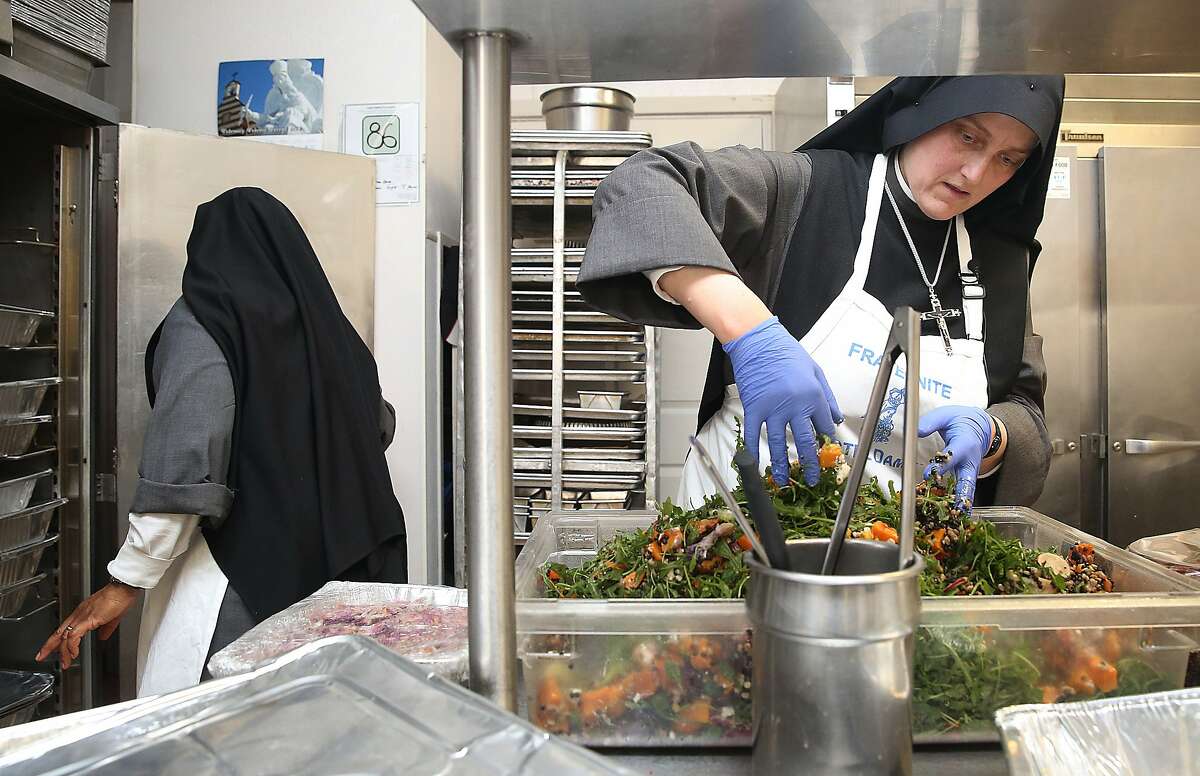 Sister Marie of the Angels (left) and Sister Marie Benedicte (right) of the Fraternite Notre Dame Mary of Nazareth Soup kitchen prepares food for lunch in San Francisco, California, on Monday, February 8, 2016. The landlord nearly doubled their rent and they are being evicted.