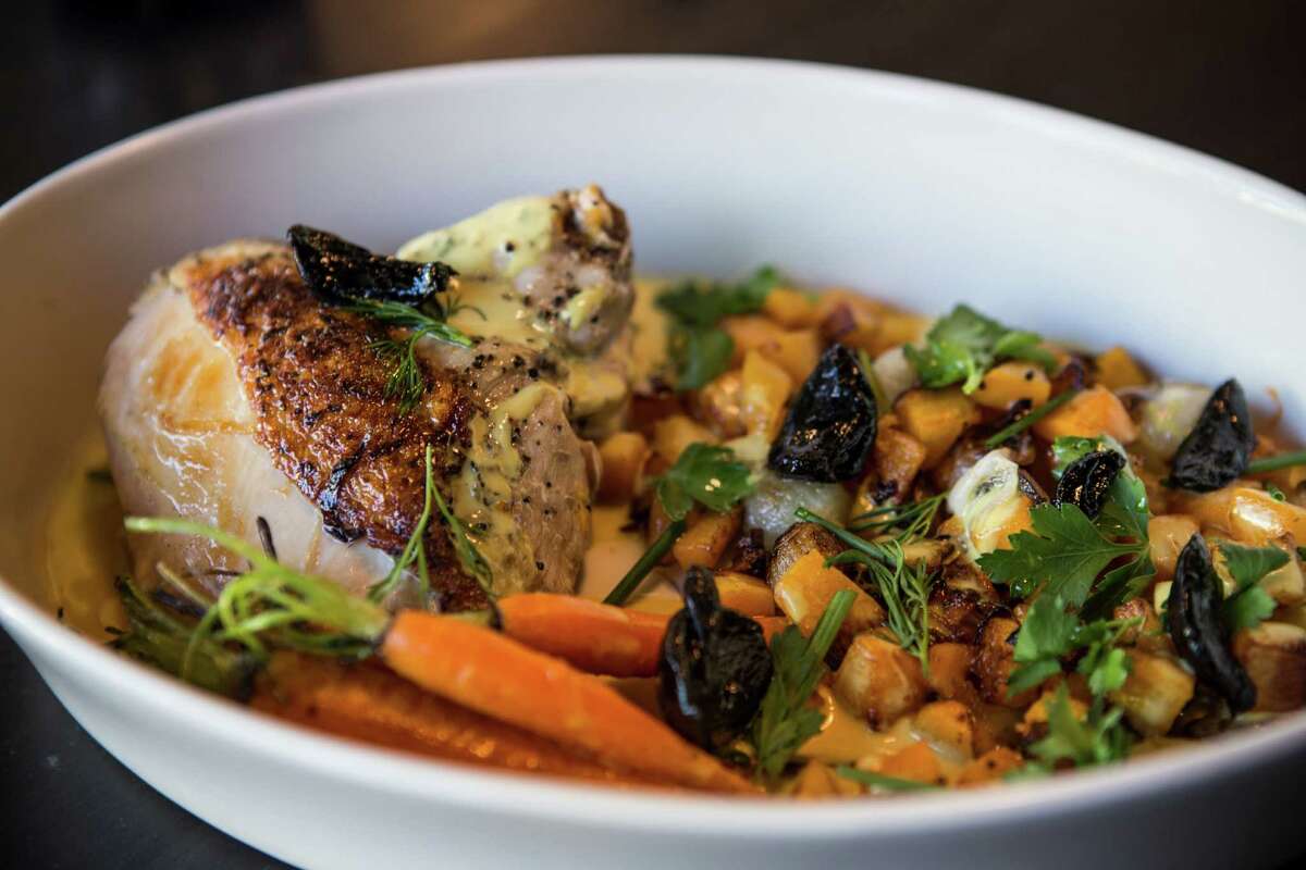Slow-roasted chicken with black garlic, butternut squash, pearl onions, baby carrots, pan mustard sauce and fresh herbs at Fielding's Local