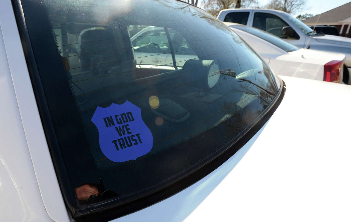The Orange City Council unanimously approved Monday the placement of the phrase "In God We Trust" on city-owned vehicles. Some Kountze patrol cars, pictured, now have religious decals posted on the windows. Photo taken February 08, 2016 Guiseppe Barranco/The Enterprise