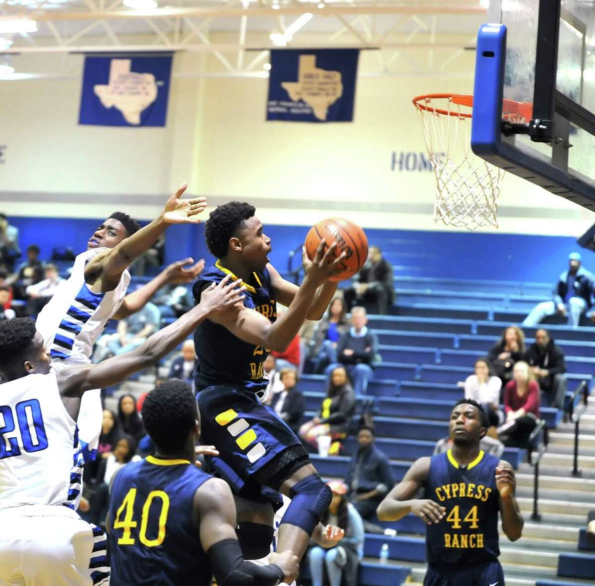 Cy Ranch and Cy Creek boys basketball teams played a game at the Cy Creek gym, 2-5-2016. Cy Ranch won the game, 56-43. Cy Ranch guard Michael Tate (23) scored on a layup in the third quarter against Cy Creek.