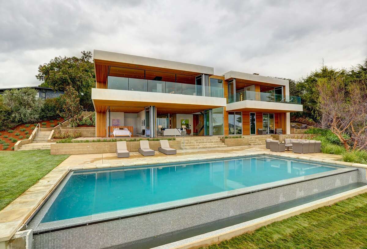 Retractable glass walls create exemplary indoor/outdoor living in Tiburon